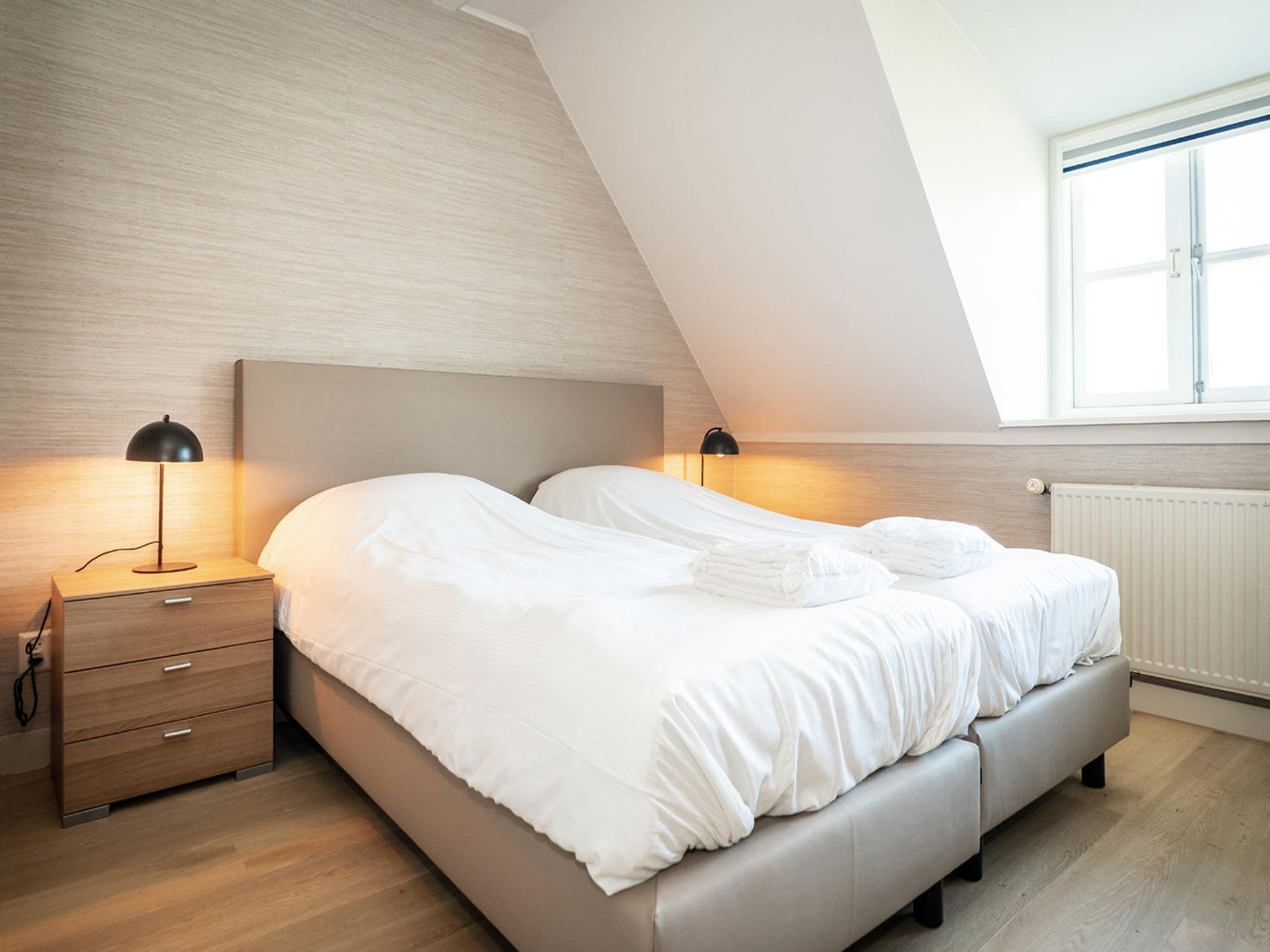 Een slaapkamer van App Hoeve Holland W6 in De Cocksdorp Texel