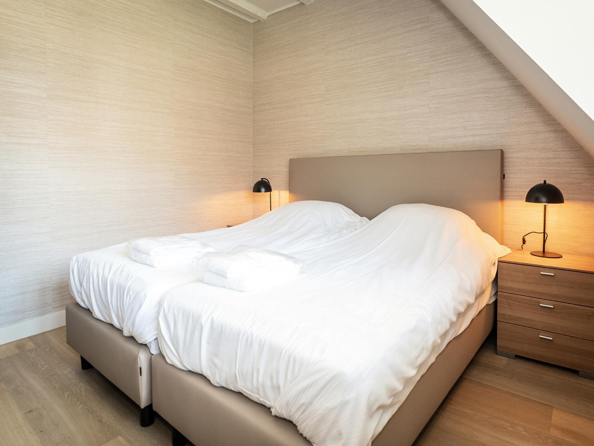 Een slaapkamer van App Hoeve Holland W6 in De Cocksdorp Texel