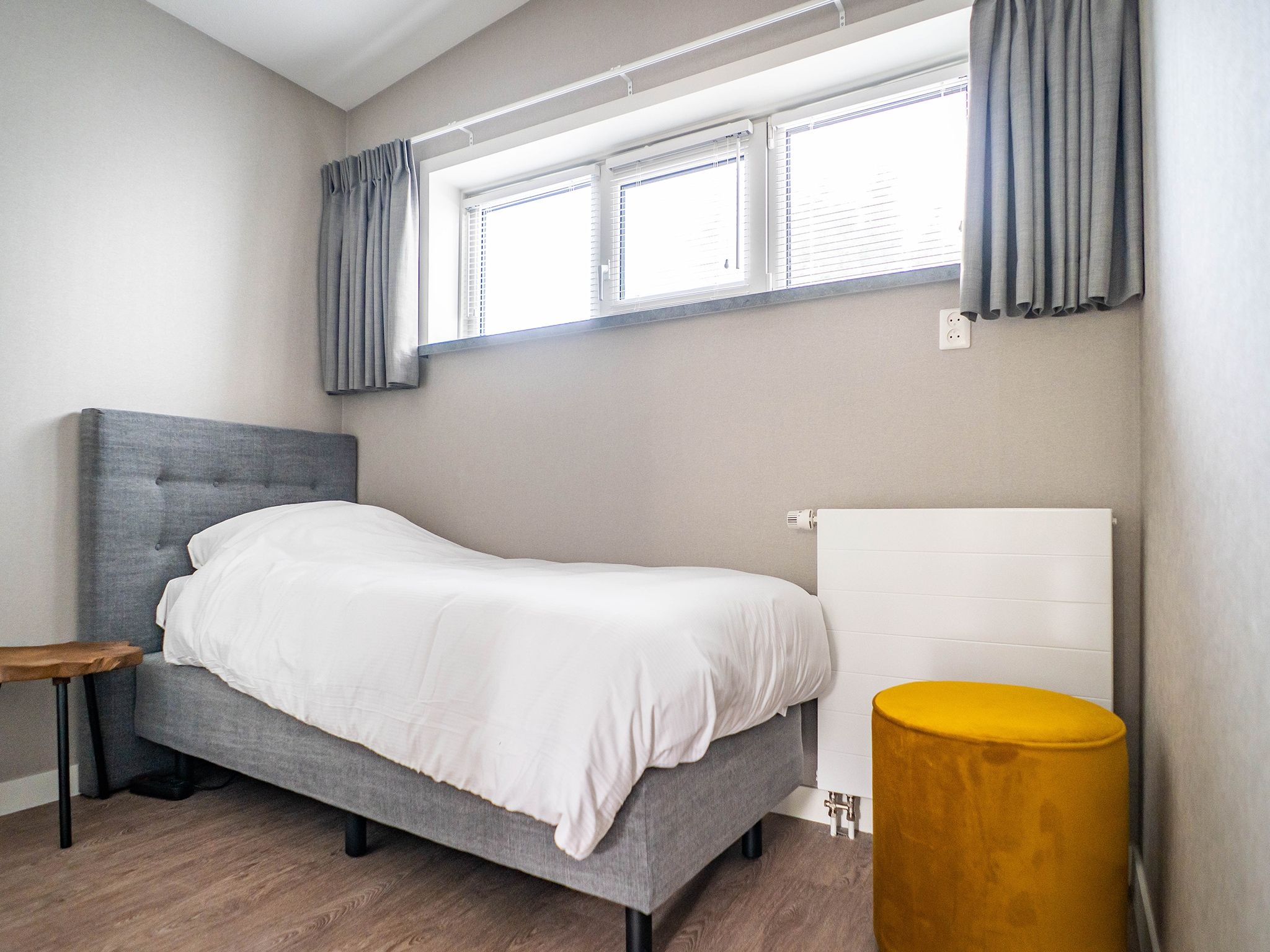 Een slaapkamer van Stoeterij C65 in De Cocksdorp Texel