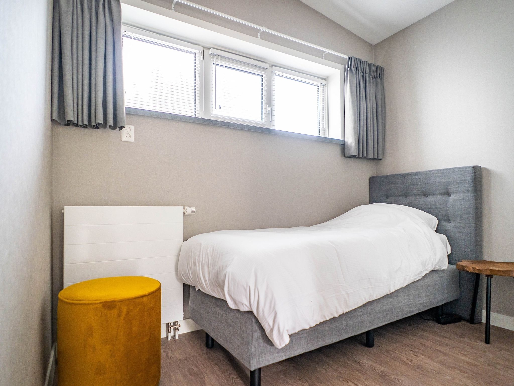 Een slaapkamer van Stoeterij C65 in De Cocksdorp Texel