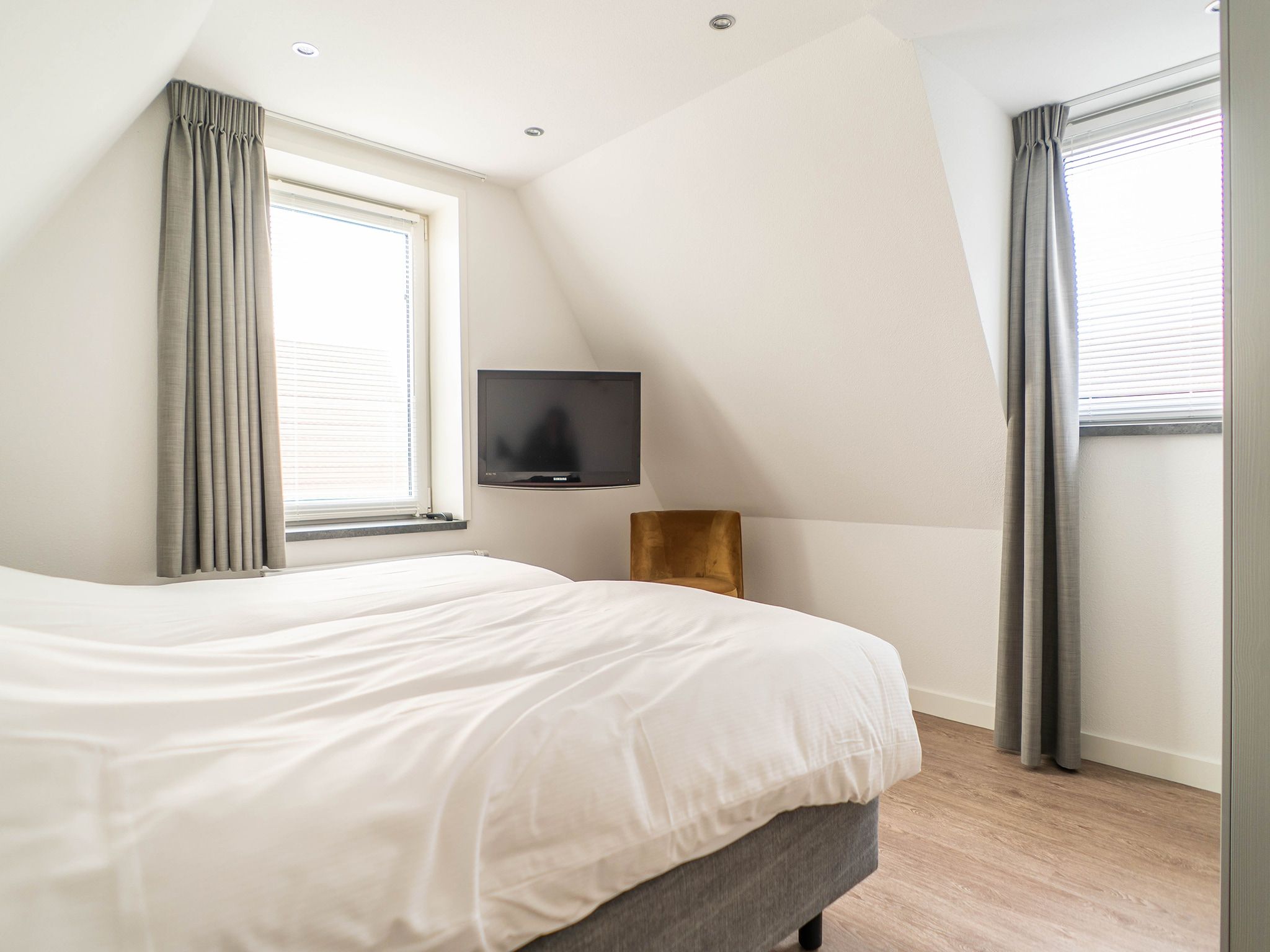 Een slaapkamer van Bungalow van der Linde D-8b in De Cocksdorp Texel