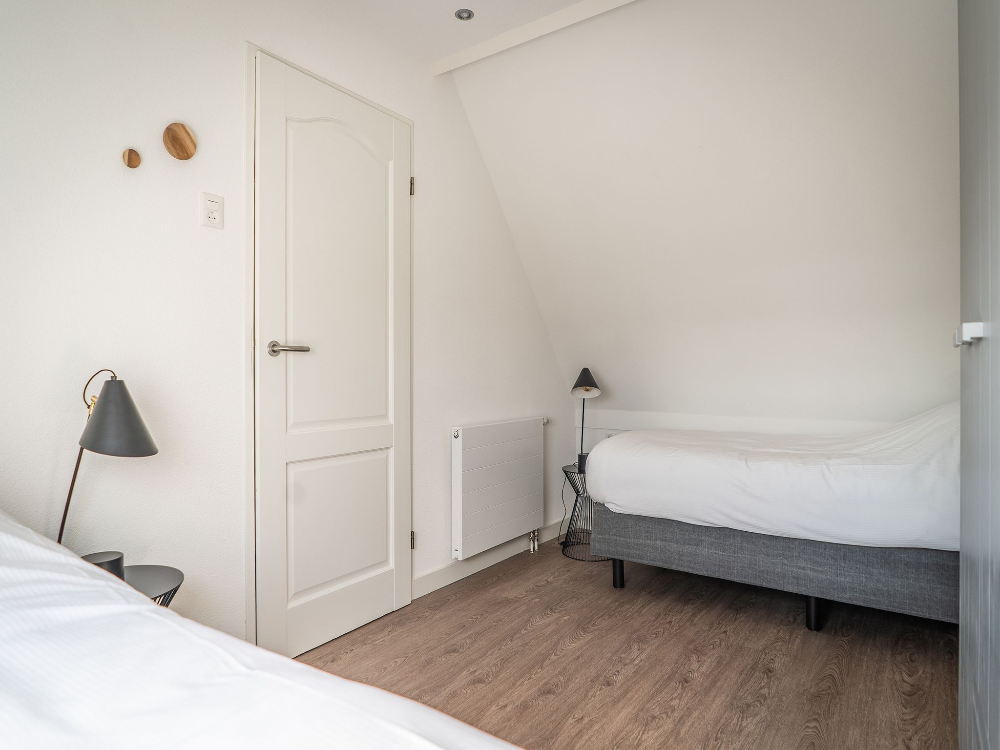 Een slaapkamer van Bungalow Roggesloot A-8a in De Cocksdorp Texel