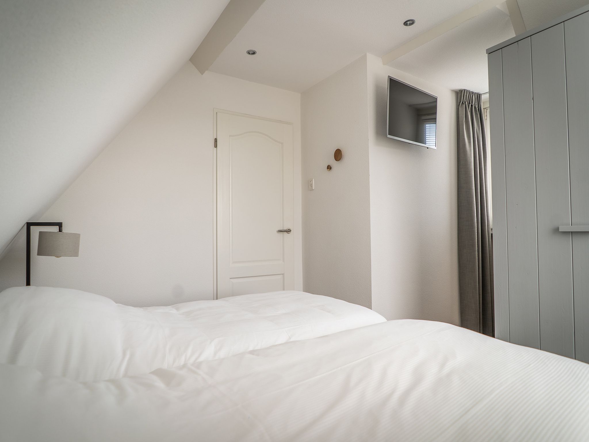 Een slaapkamer van Bungalow Roggesloot A-8a in De Cocksdorp Texel