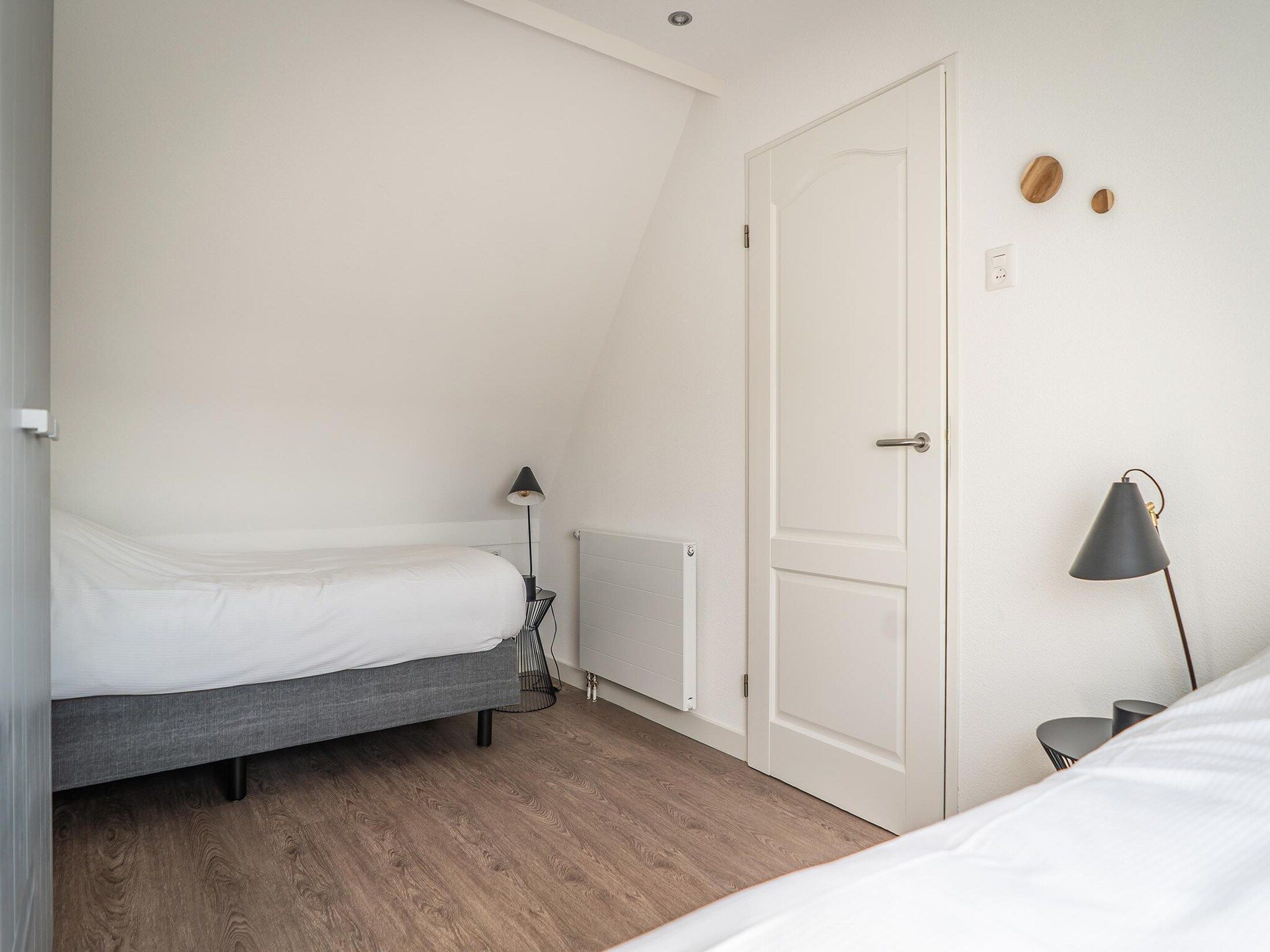 Een slaapkamer van Bungalow Roggesloot A-8a in De Cocksdorp Texel