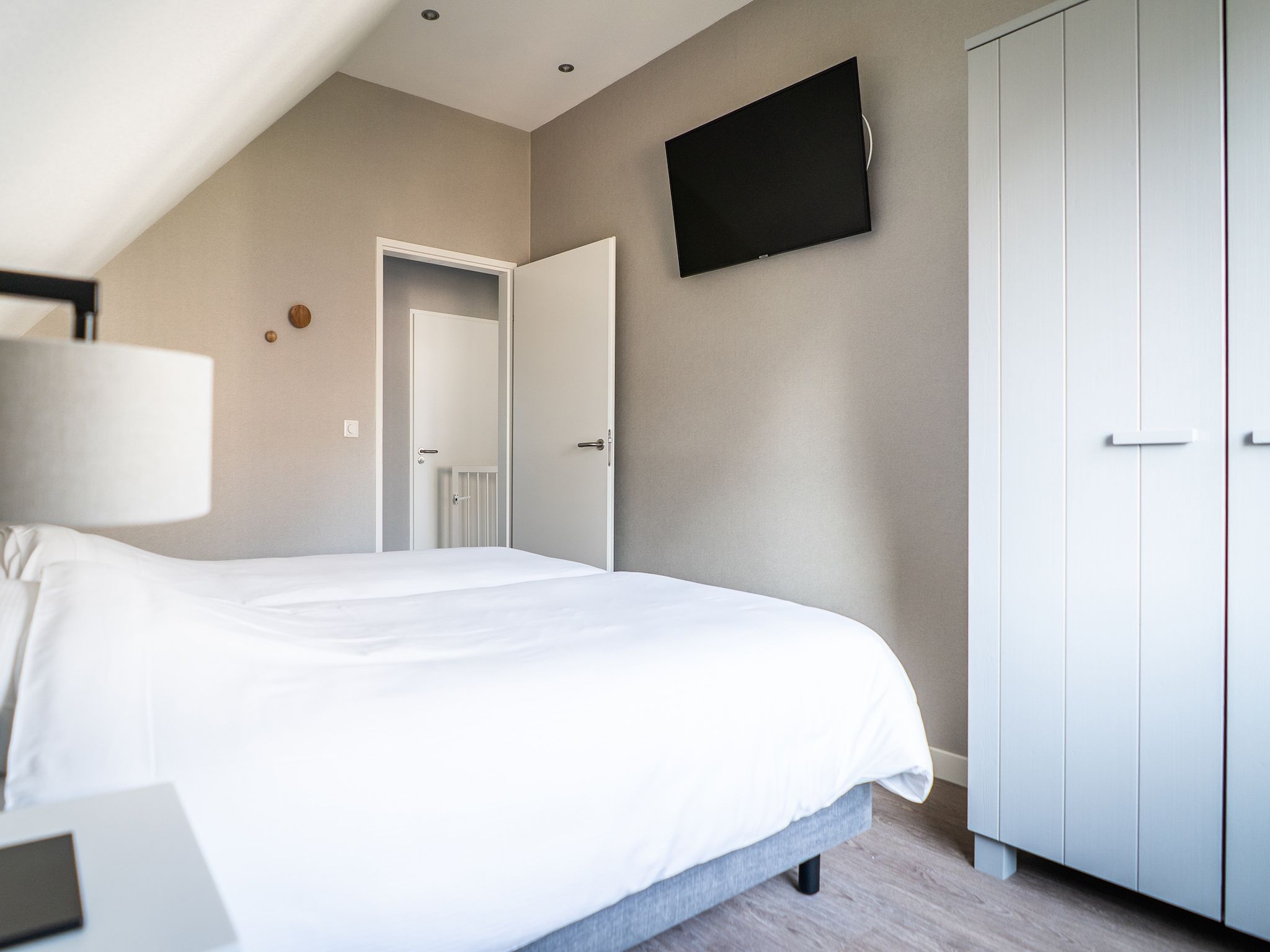 Een slaapkamer van Hodshonstraat B-12 in De Cocksdorp