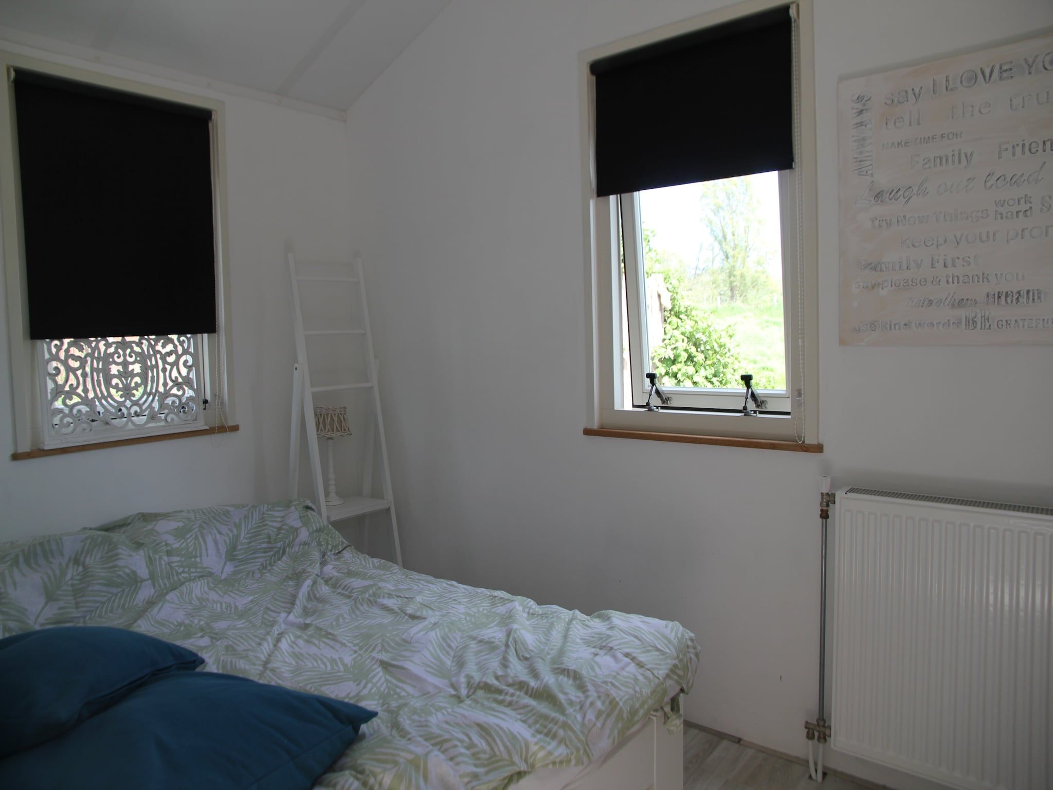 Een slaapkamer van Landelijk bij Zee in Warmenhuizen