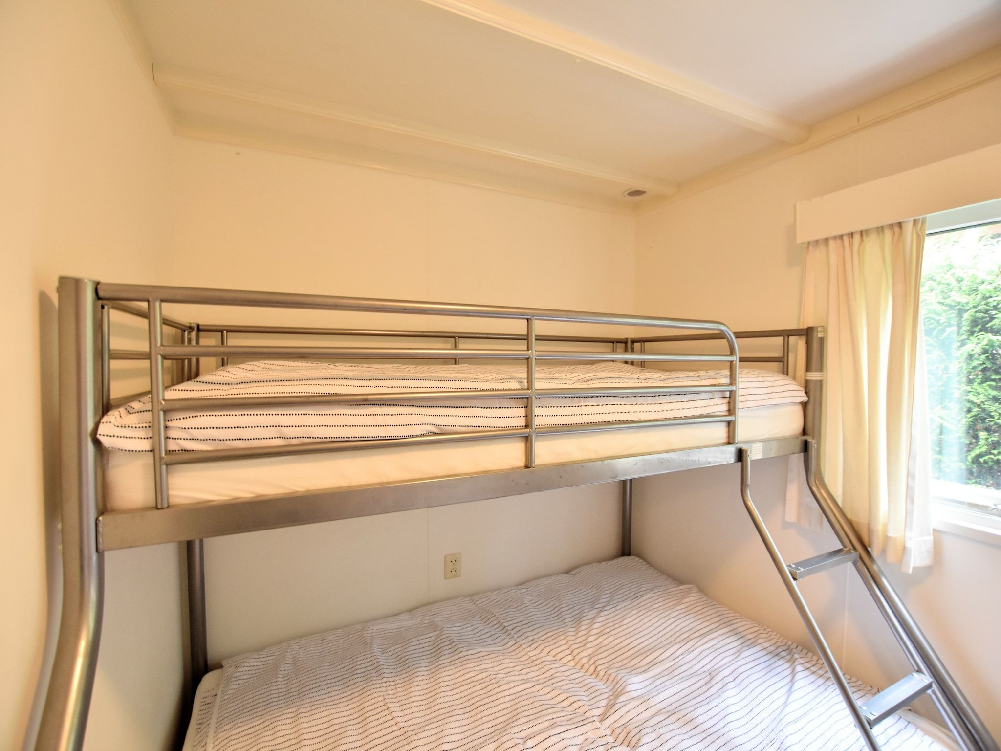 Een slaapkamer van Reewold in Putten