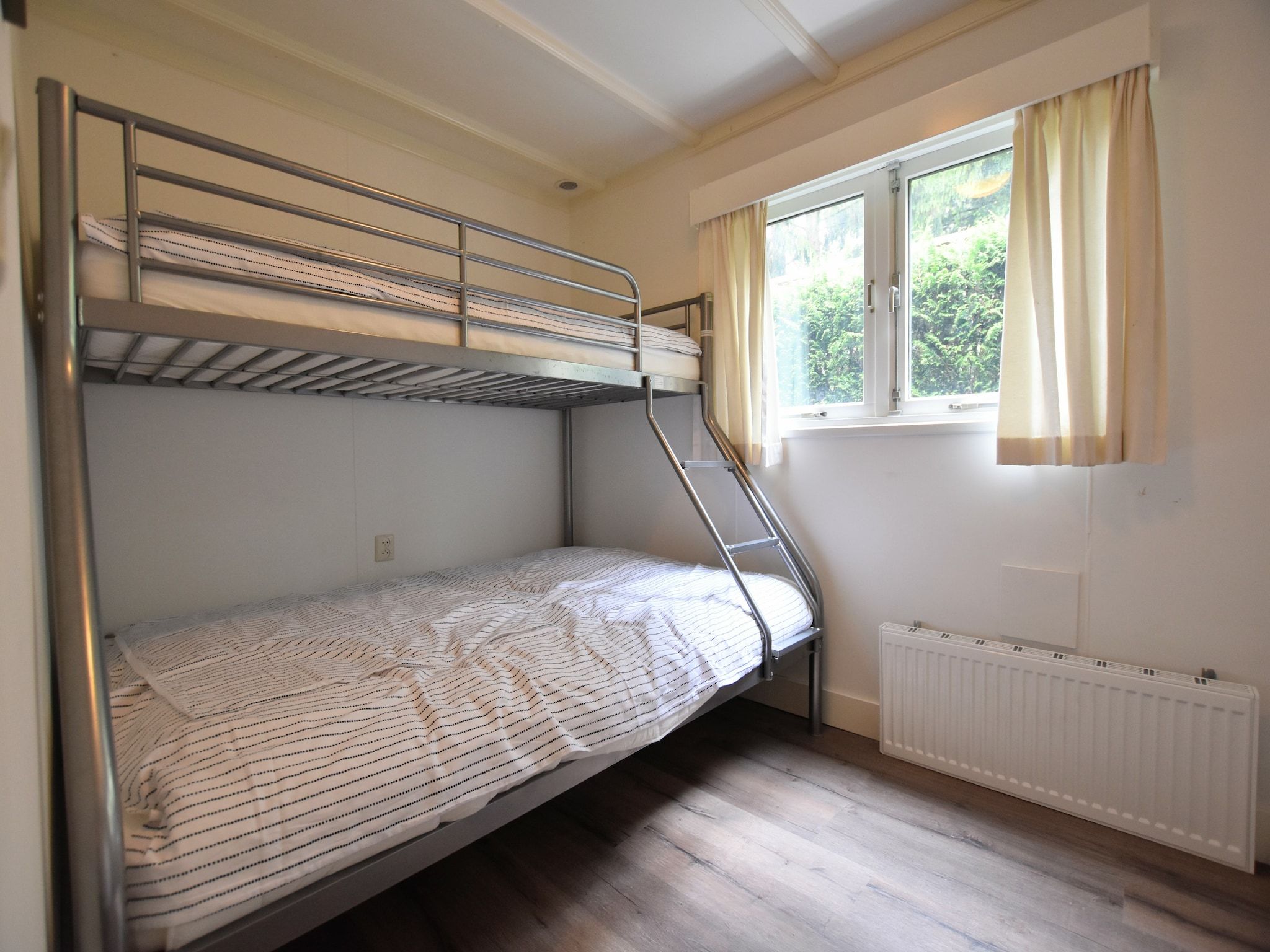 Een slaapkamer van Reewold in Putten