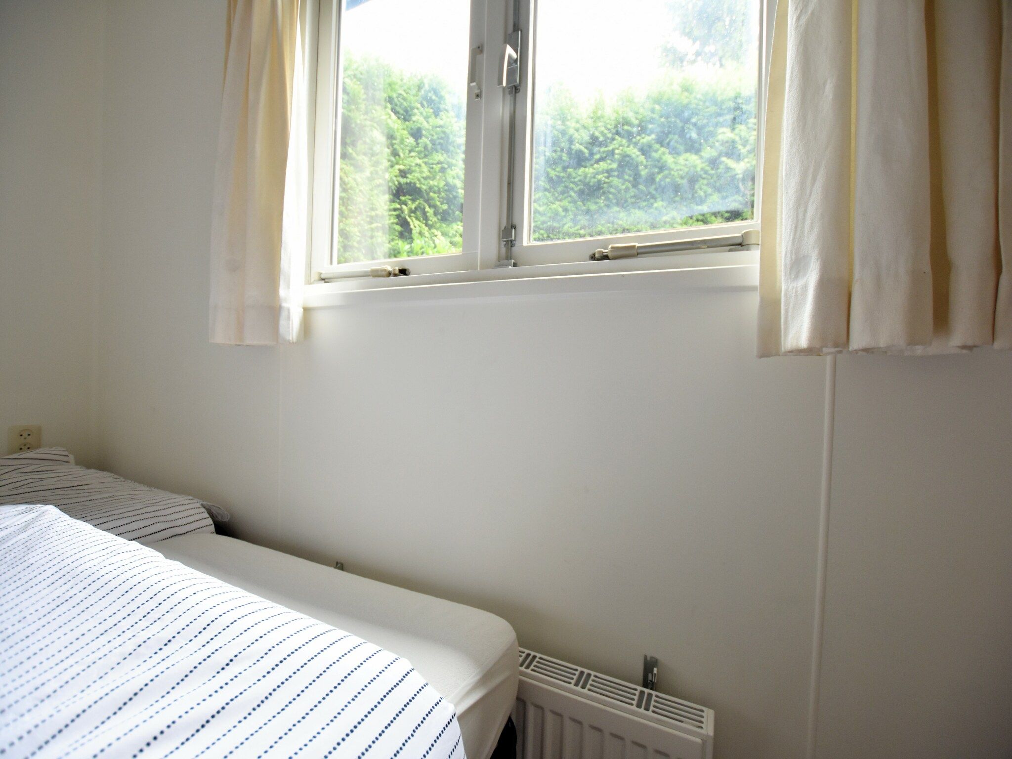 Een slaapkamer van Reewold in Putten