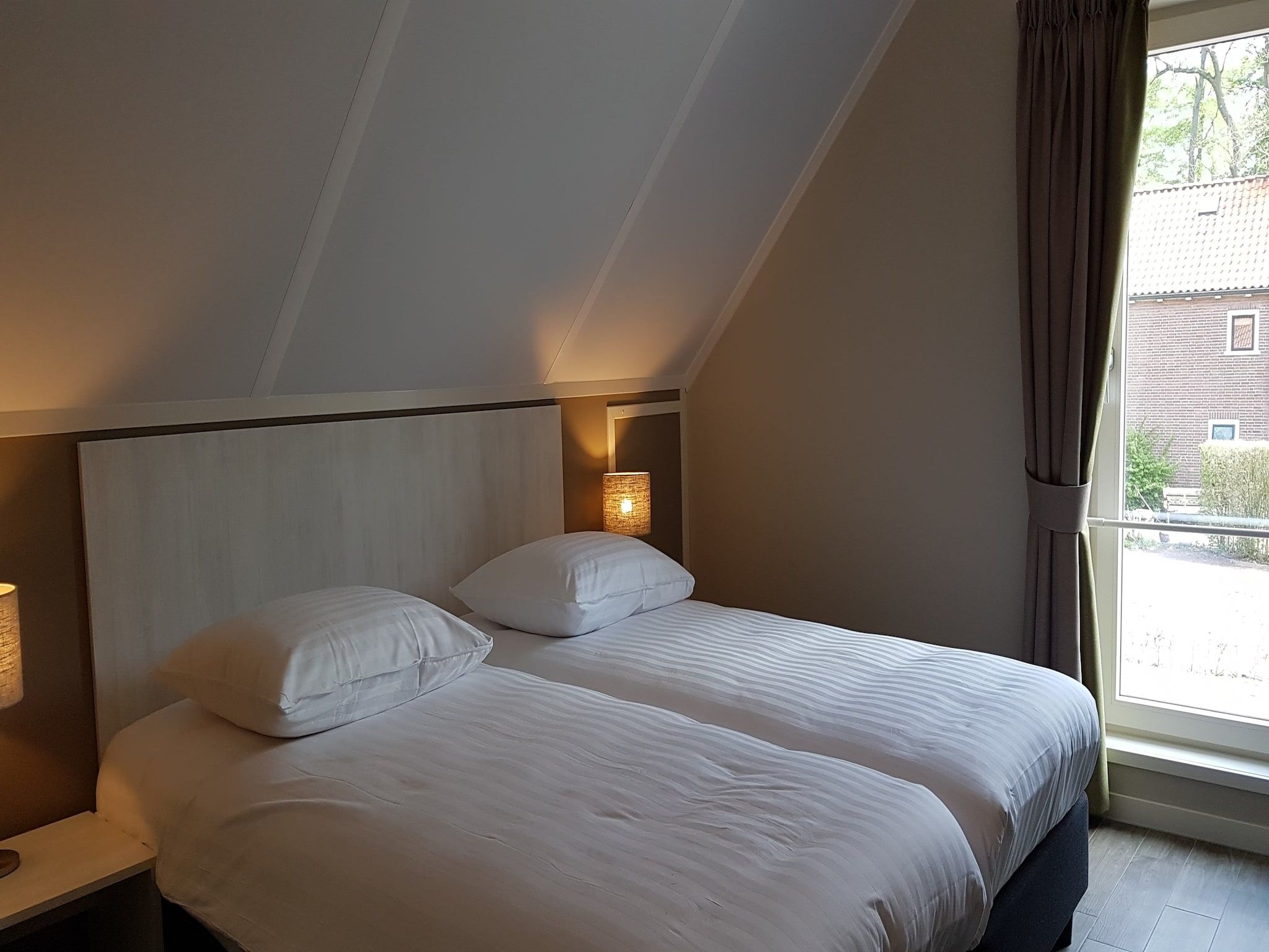 Een slaapkamer van Villapark Ehzerburg 1 in Almen