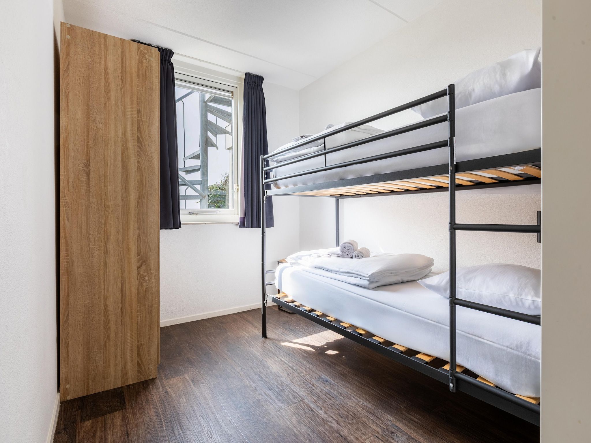 Een slaapkamer van Roompot Beach Resort 21 in Kamperland