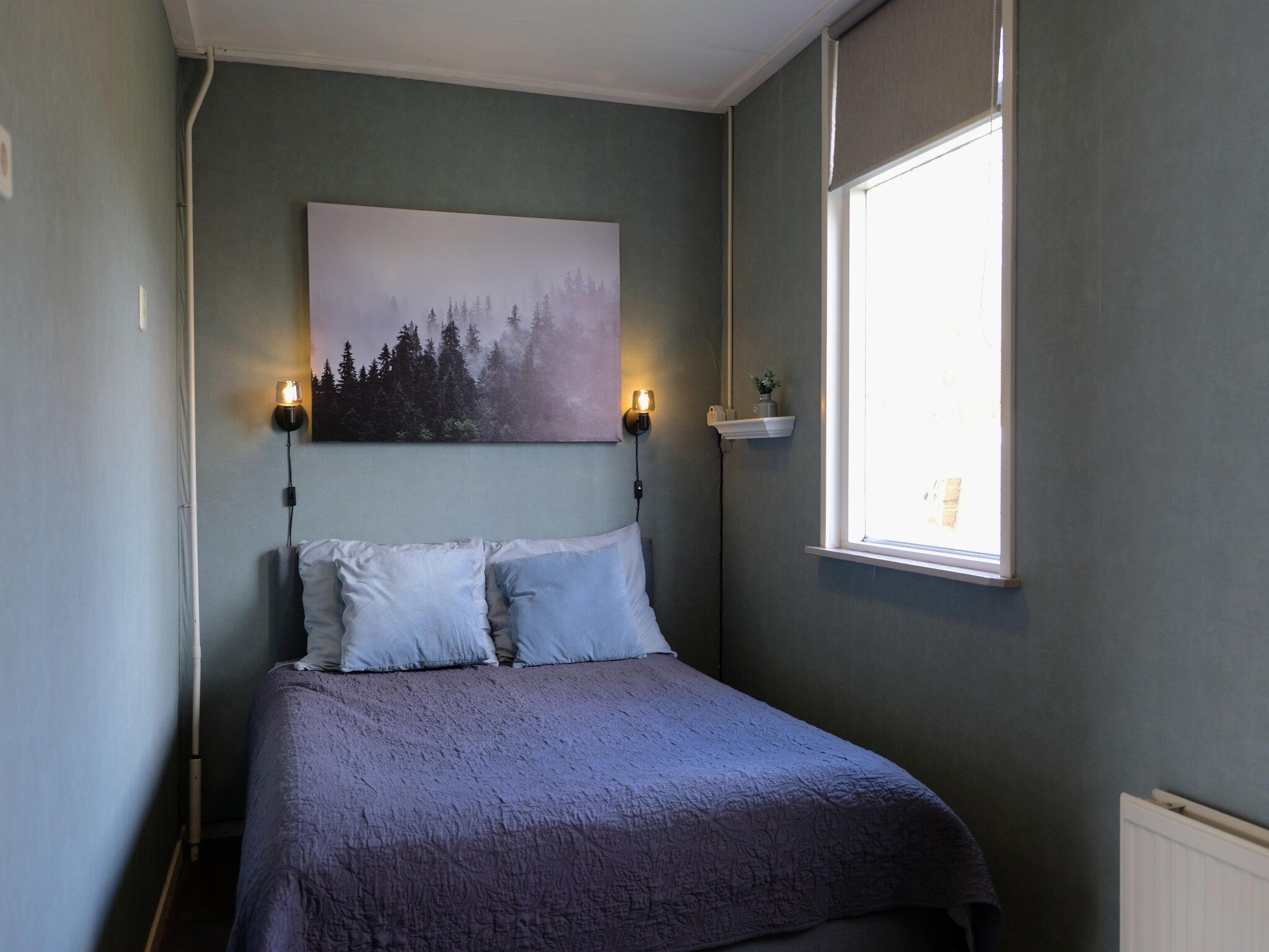 Een slaapkamer van Aan de dwarsgracht in Giethoorn