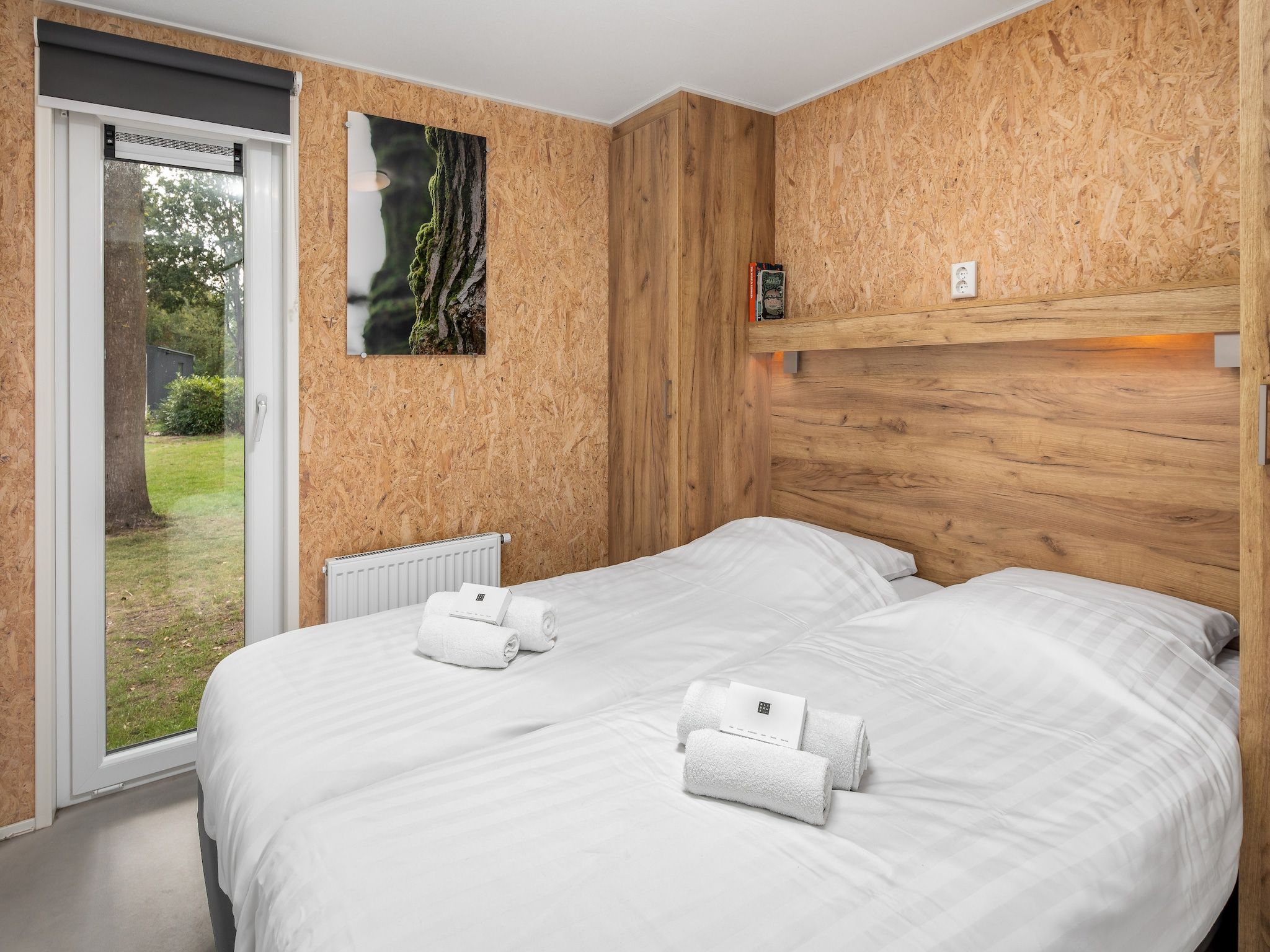 Een slaapkamer van Vakantiepark Hunzedal 12 in Borger