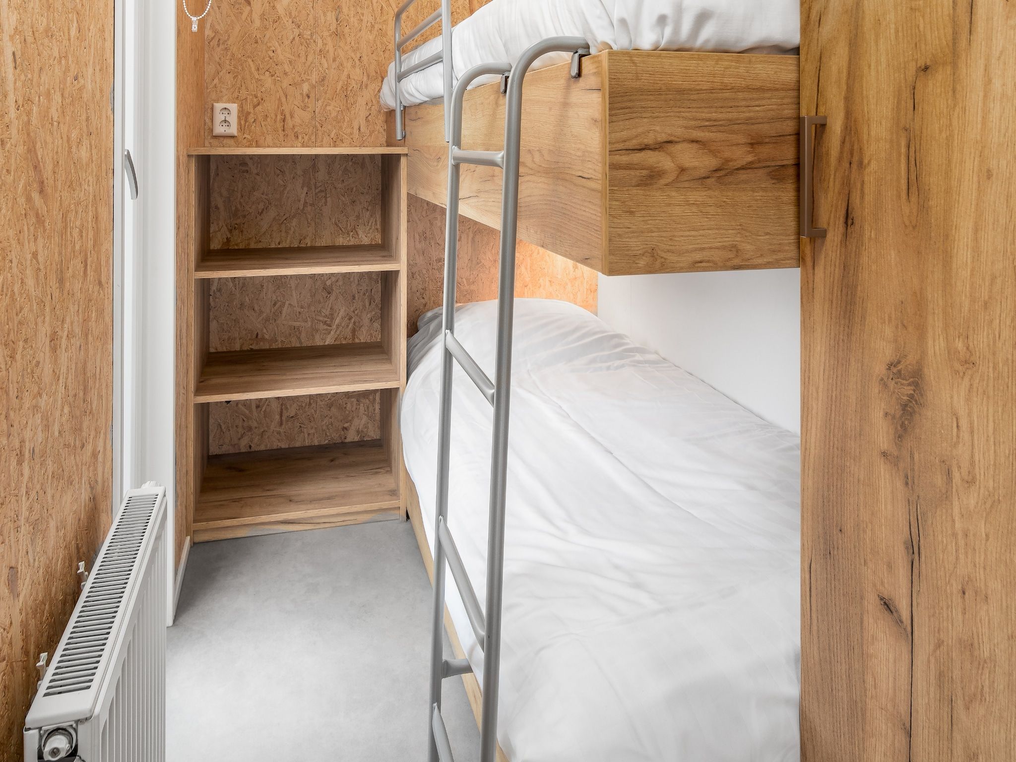 Een slaapkamer van Vakantiepark Hunzedal 12 in Borger