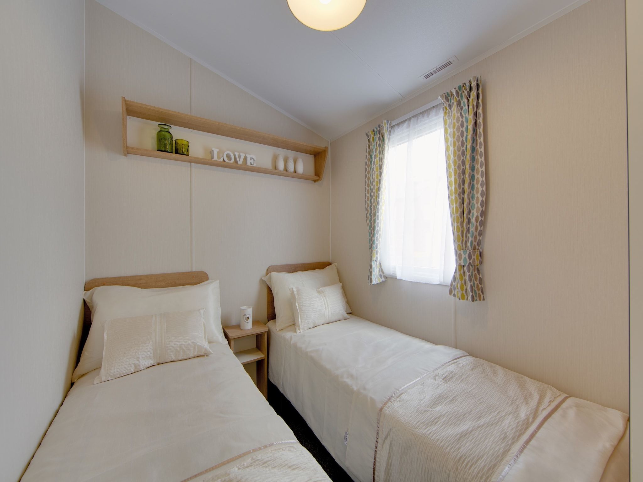 Een slaapkamer van Vakantiepark Hunzedal 10 in Borger