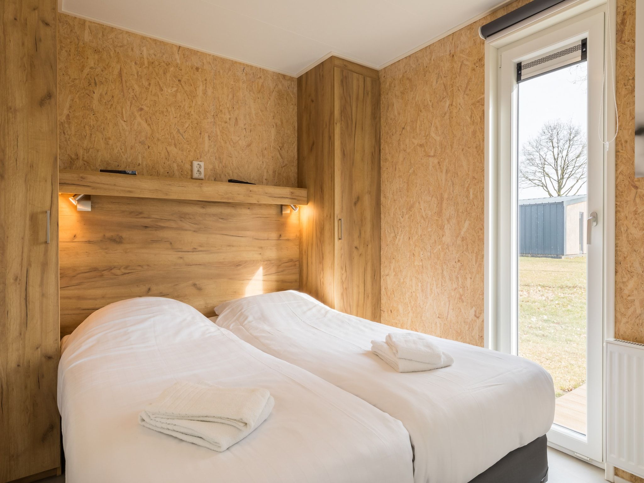 Een slaapkamer van Vakantiepark Hunzedal 11 in Borger