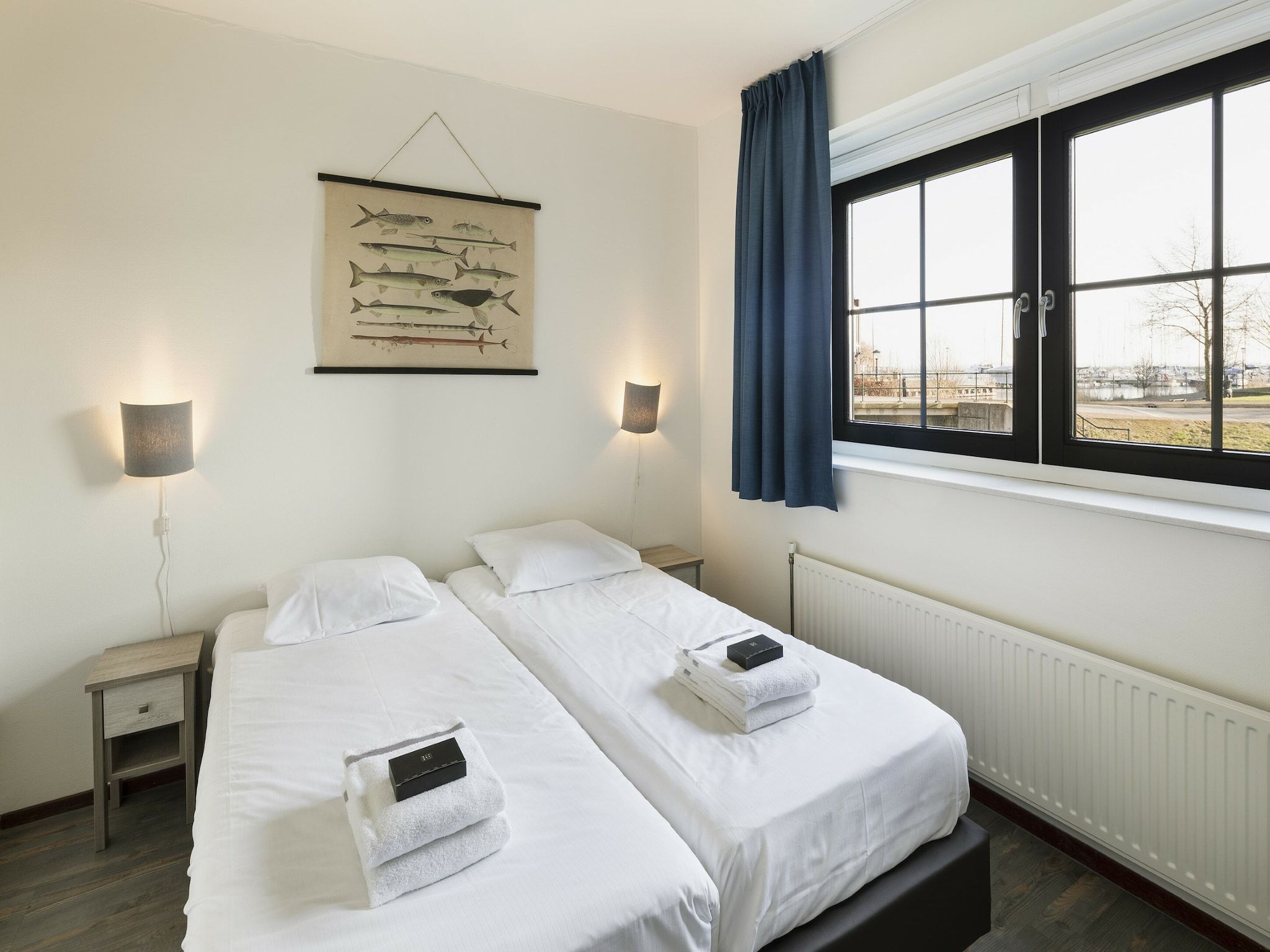 Een slaapkamer van Marinapark Volendam 10 in Volendam