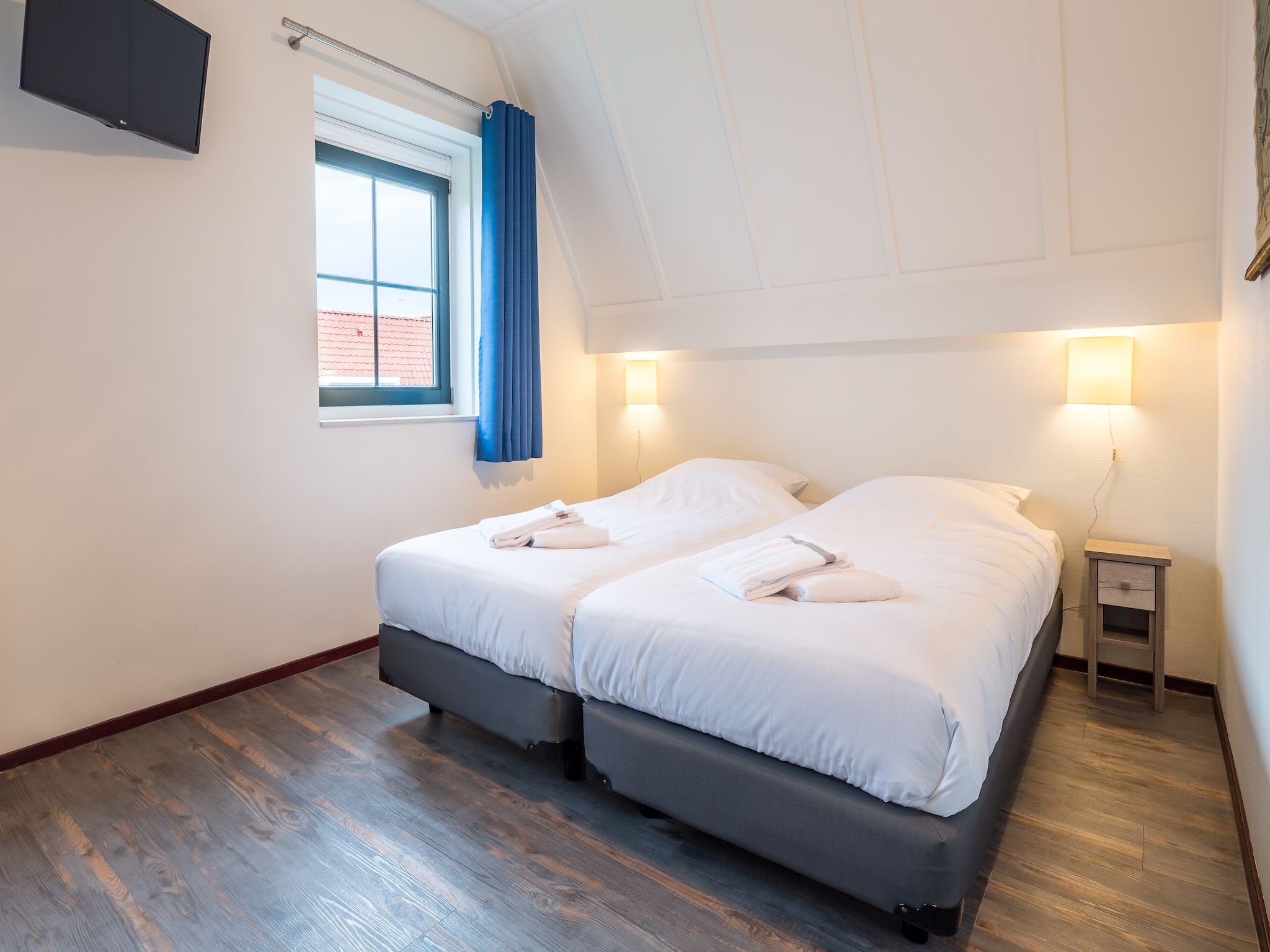 Een slaapkamer van Marinapark Volendam 12 in Volendam