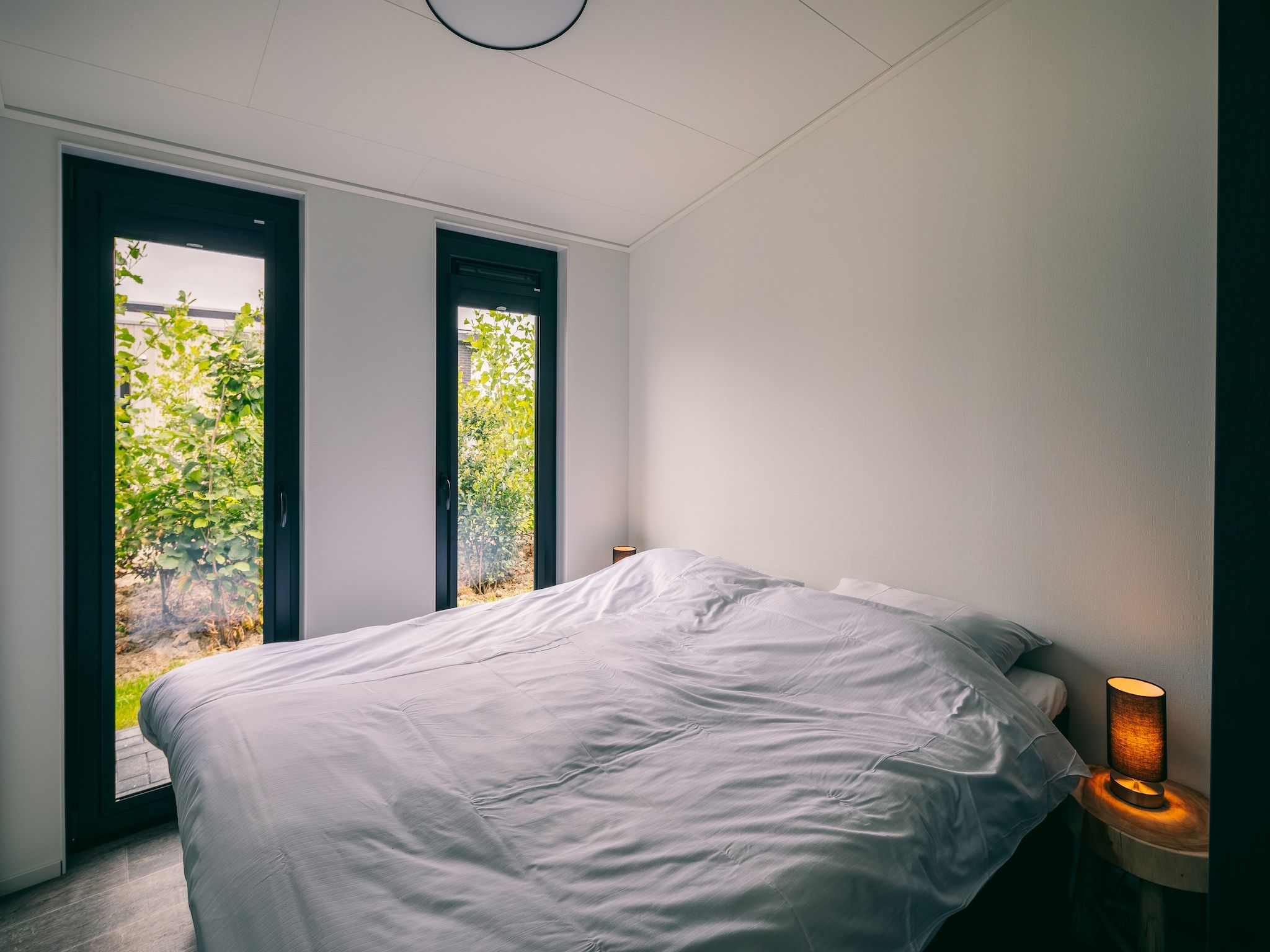 Een slaapkamer van Vakantiepark Zeedijk 3 in Herkingen