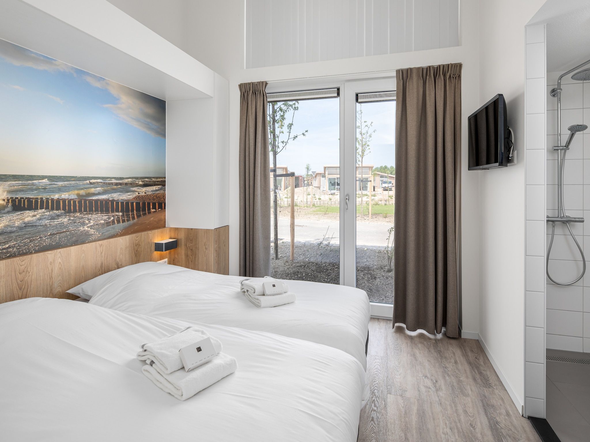 Een slaapkamer van Water Village 4 in Kamperland