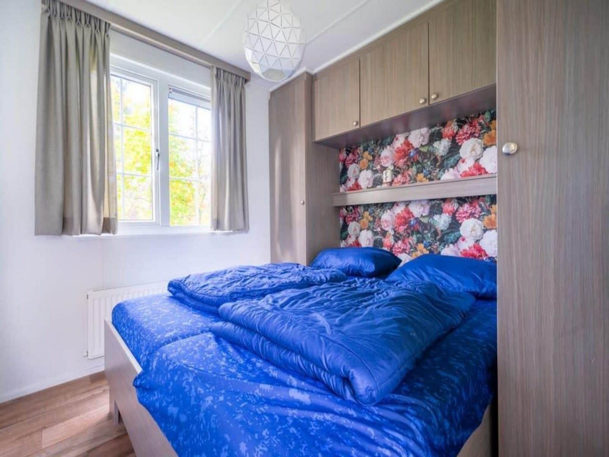 Een slaapkamer van Mobilehome 4 in Otterlo