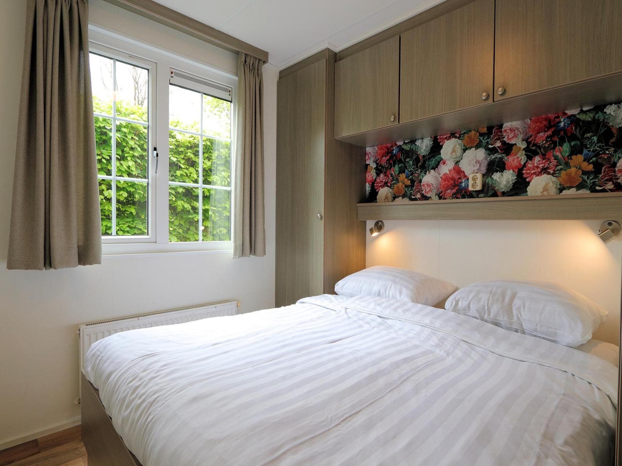 Een slaapkamer van Mobilehome 6 in Otterlo