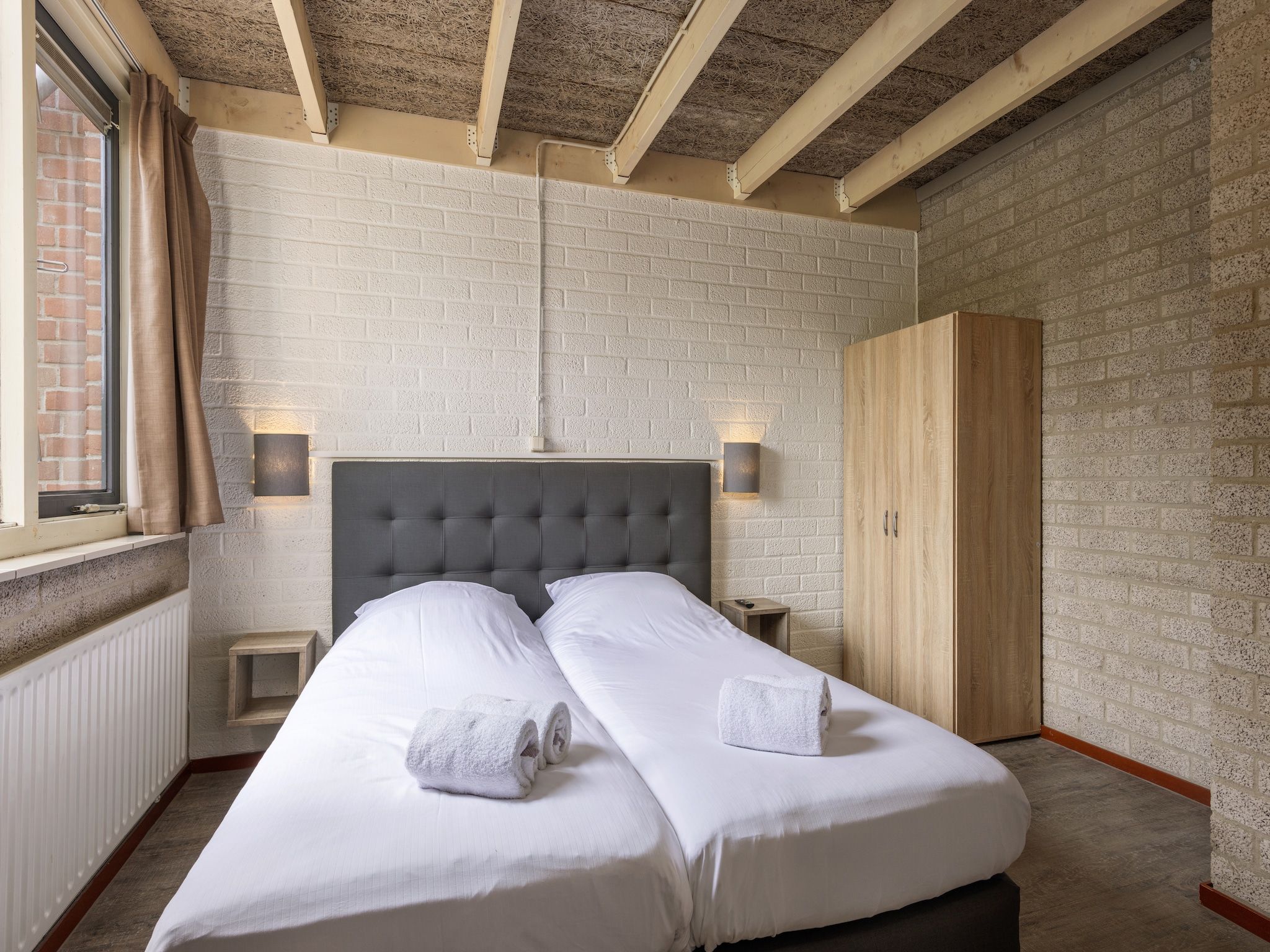 Een slaapkamer van Vakantiepark Weerterbergen 9 in Weert