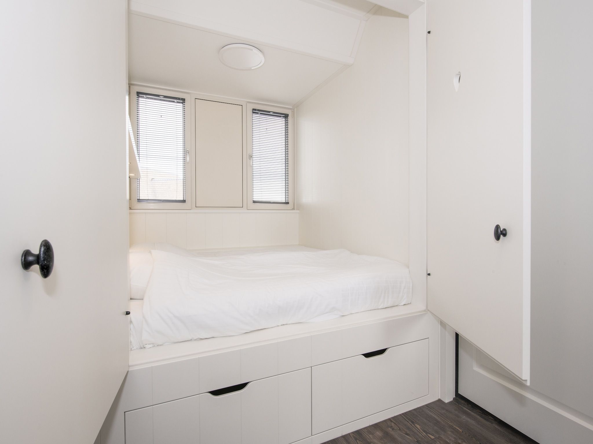 Een slaapkamer van Friese Meren Villa's 2 in Delfstrahuizen