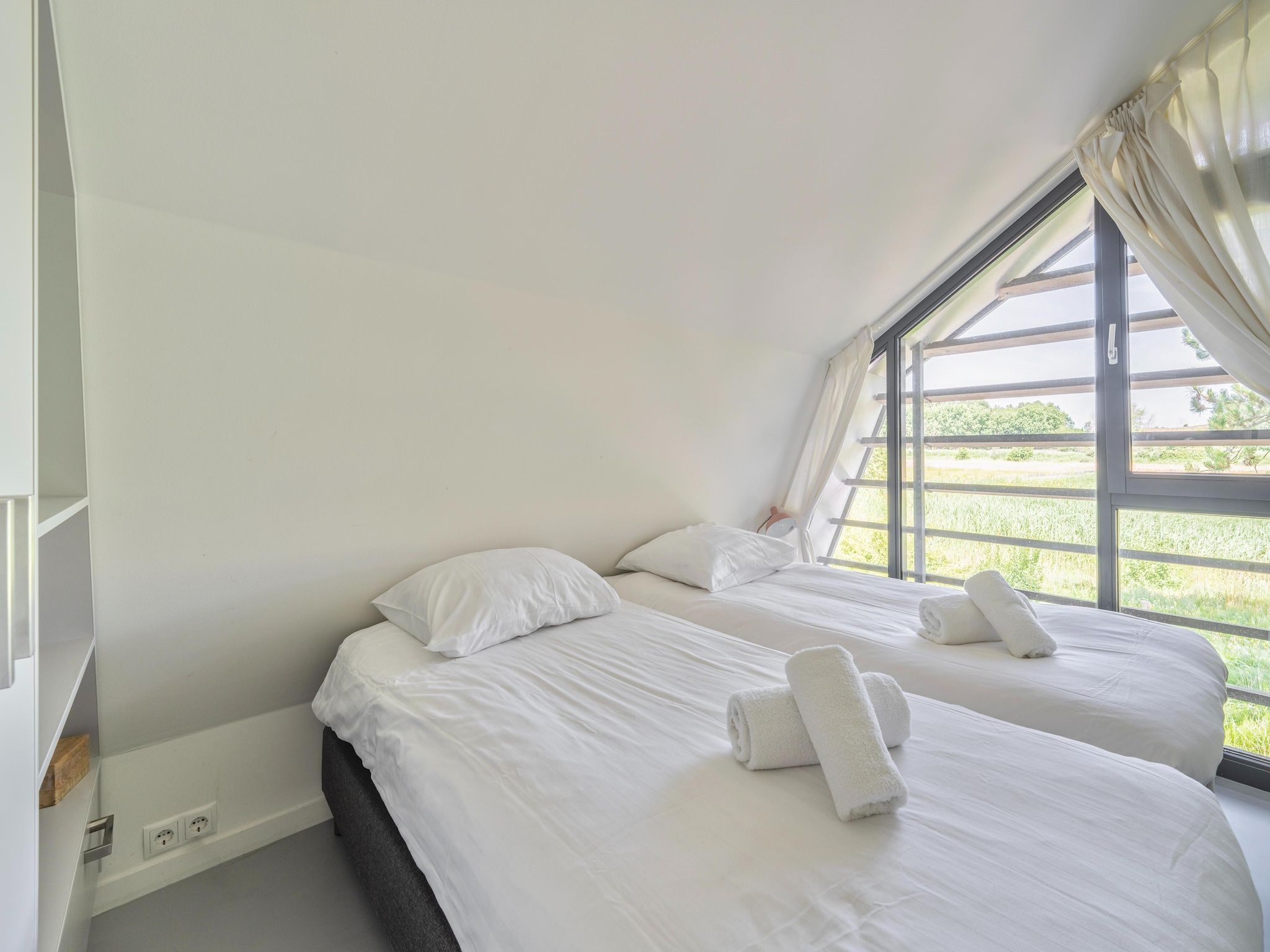 Een slaapkamer van Duinvilla aan het Meer in Egmond aan den Hoef