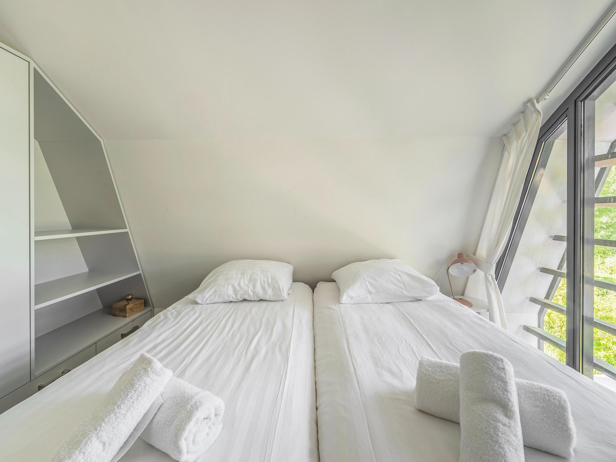 Een slaapkamer van Duinvilla in Egmond aan den Hoef