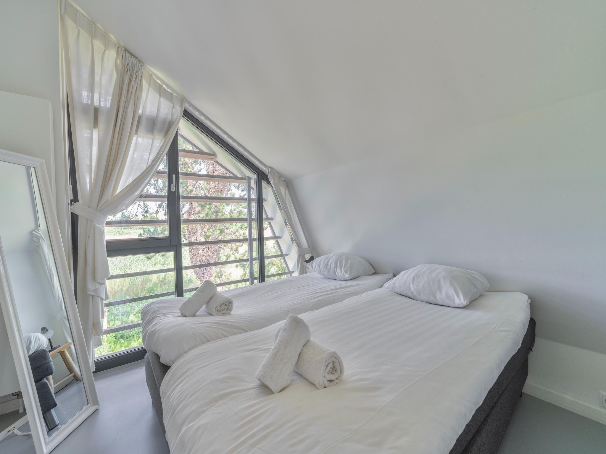 Een slaapkamer van Duinvilla aan het Meer in Egmond aan den Hoef