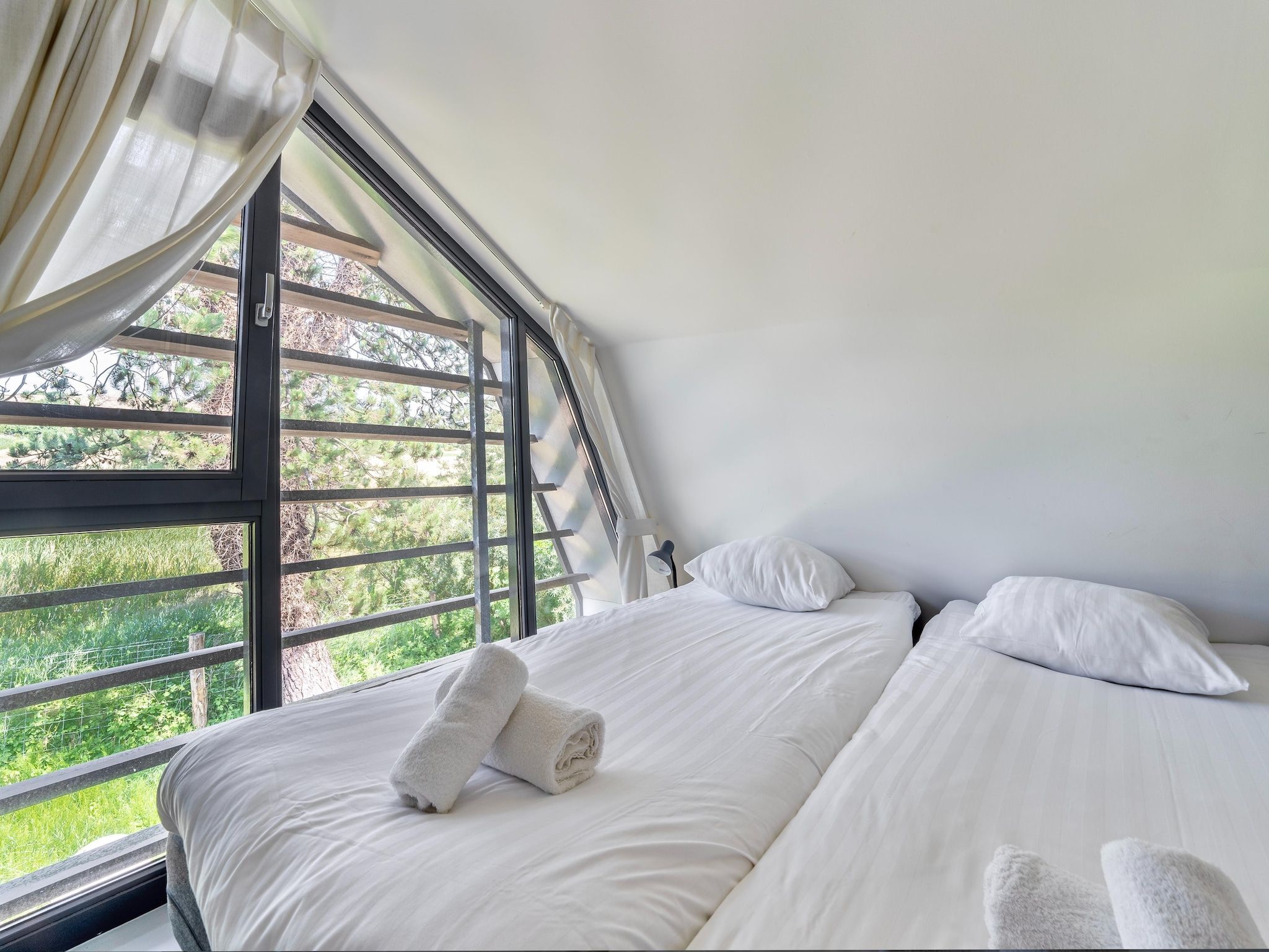 Een slaapkamer van Duinvilla aan het Meer in Egmond aan den Hoef