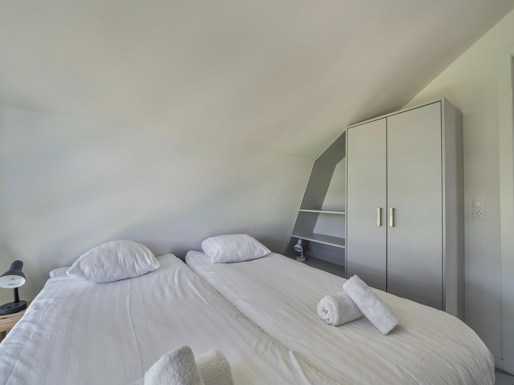 Een slaapkamer van Duinvilla in Egmond aan den Hoef