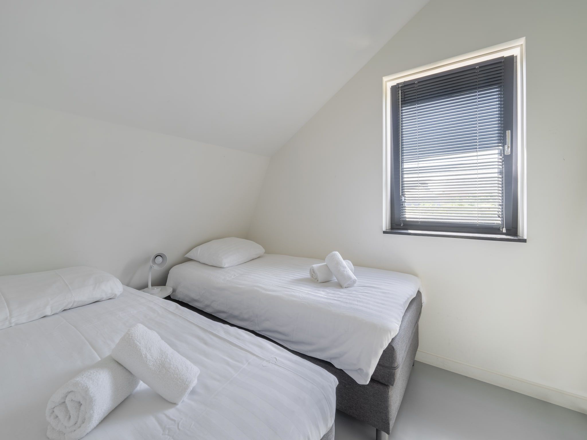 Een slaapkamer van Duinvilla in Egmond aan den Hoef