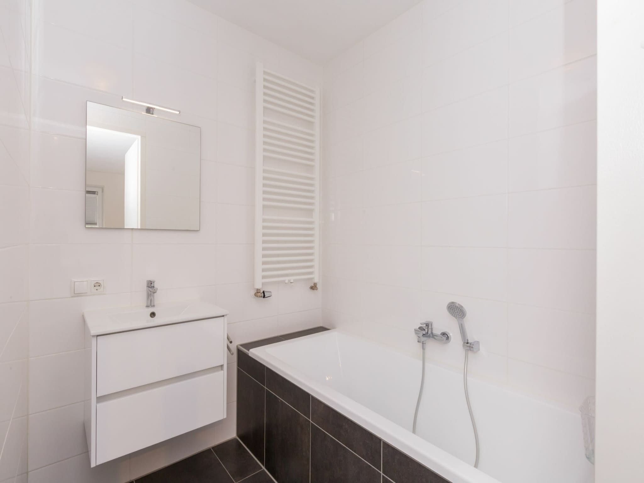 De badkamer van Appartement Duinhof Dishoek 13H - 6 pers de luxe in Koudekerke