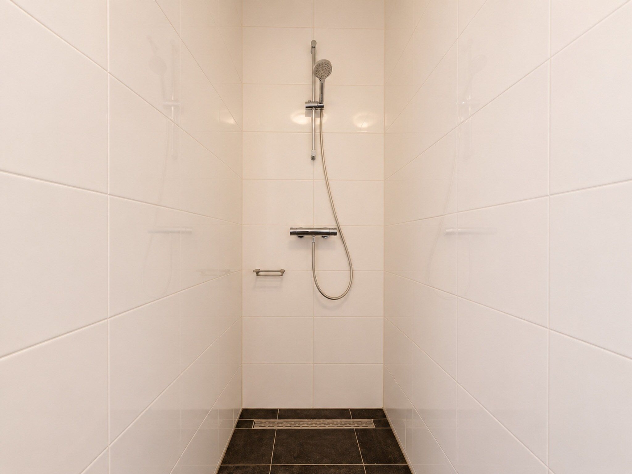 De badkamer van Appartement Duinhof Dishoek 13H - 6 pers de luxe in Koudekerke