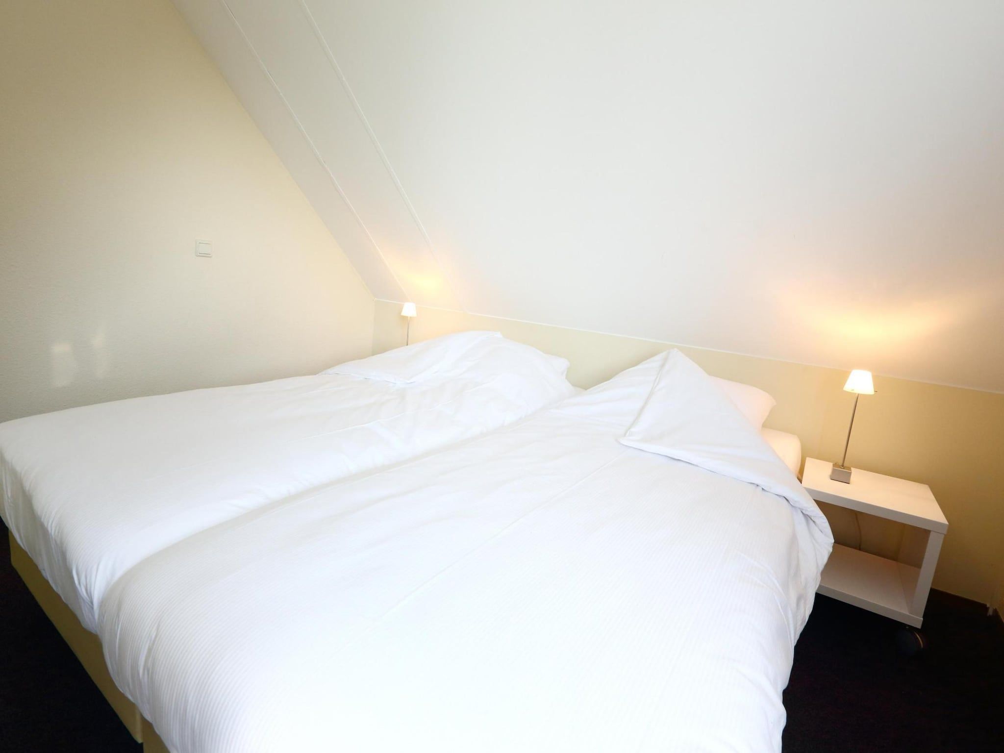 Een slaapkamer van Vakantiepark Emslandermeer 1 in Vlagtwedde