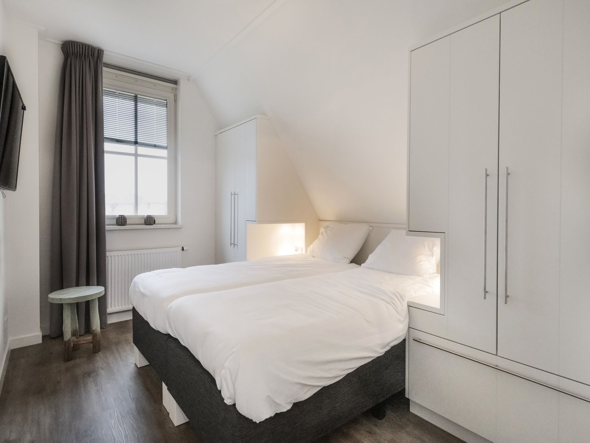 Een slaapkamer van Friese Meren Villa's 7 in Delfstrahuizen