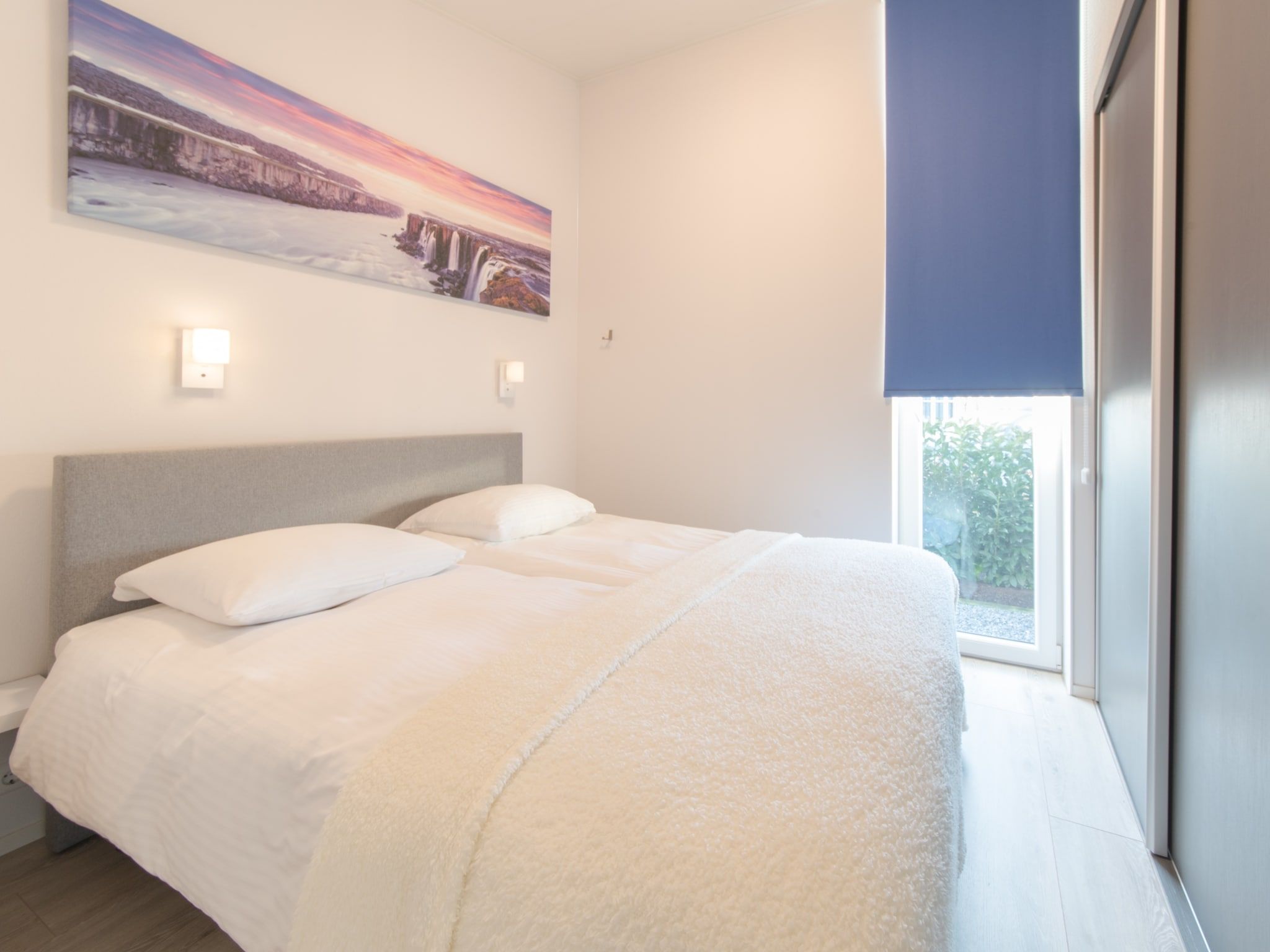 Een slaapkamer van Water Resort Oosterschelde 103 in Wemeldinge