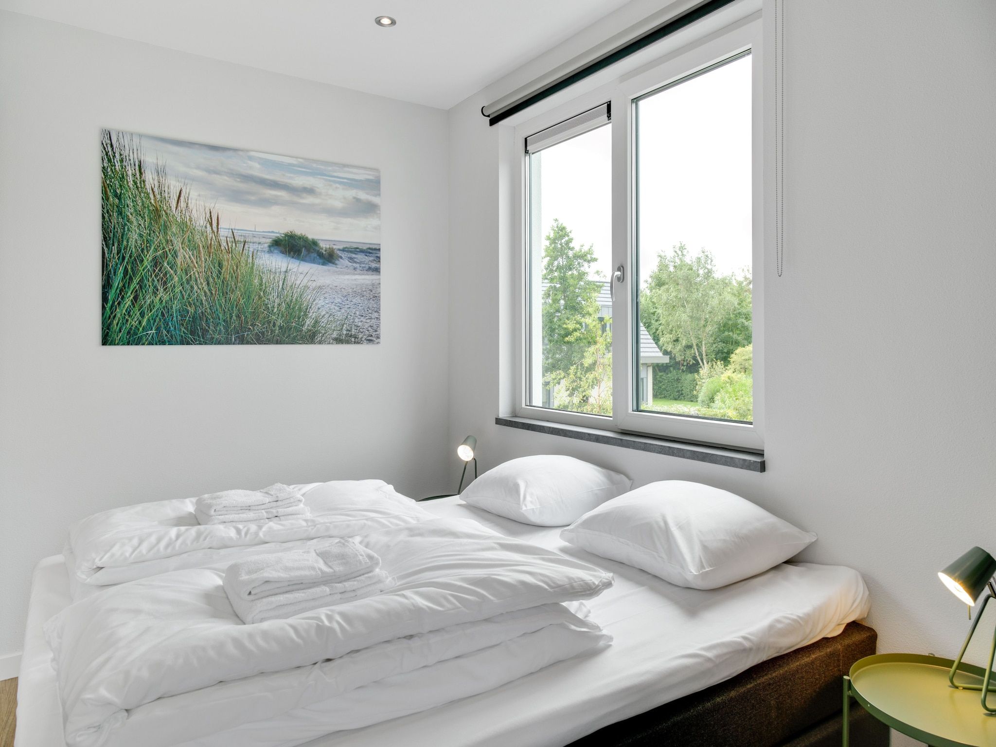 Een slaapkamer van De Koog nr 1 - 6 pers woning de luxe in De Koog Texel