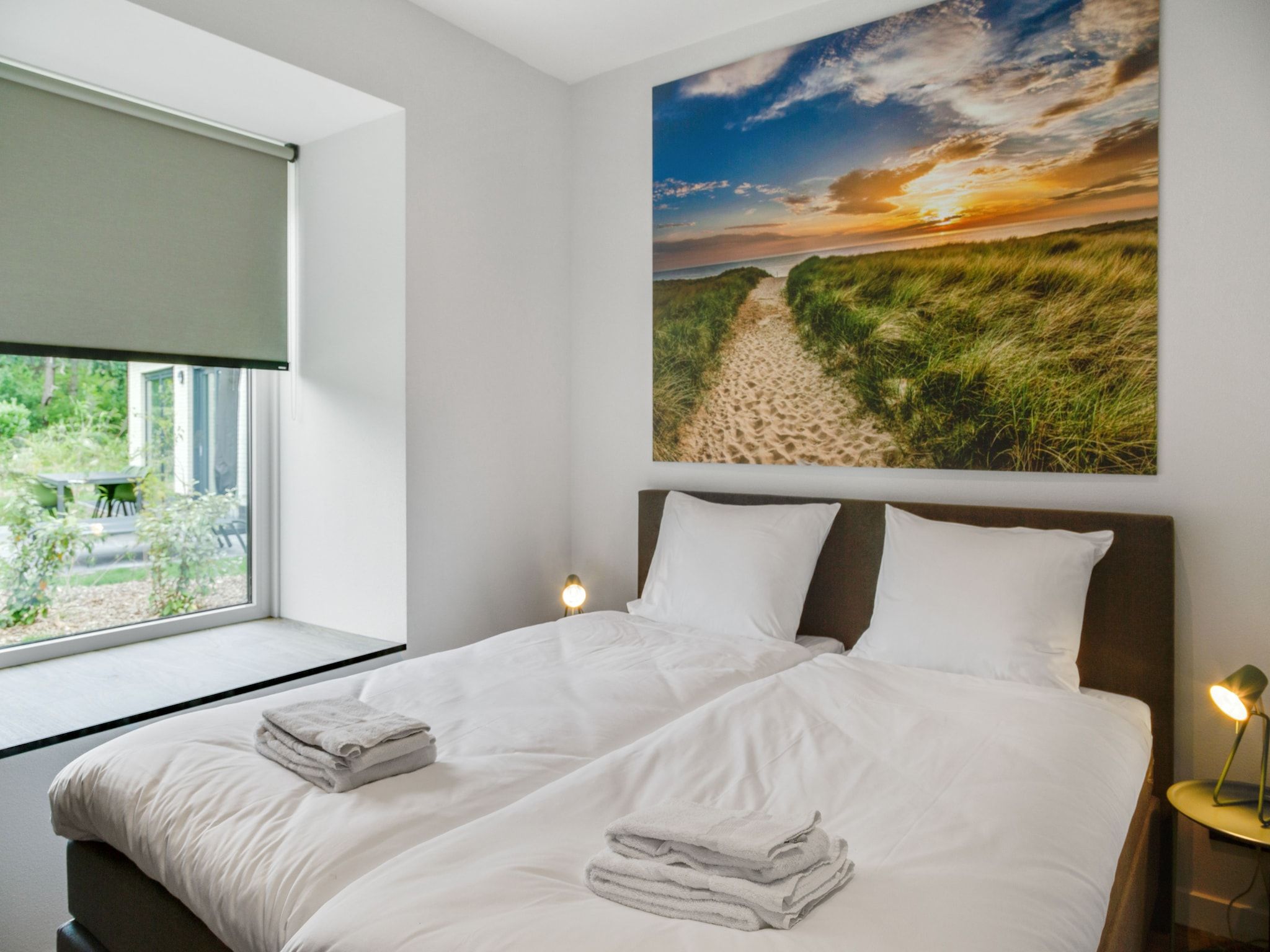 Een slaapkamer van De Koog  nr 4 - 6 pers woning de luxe in De Koog Texel