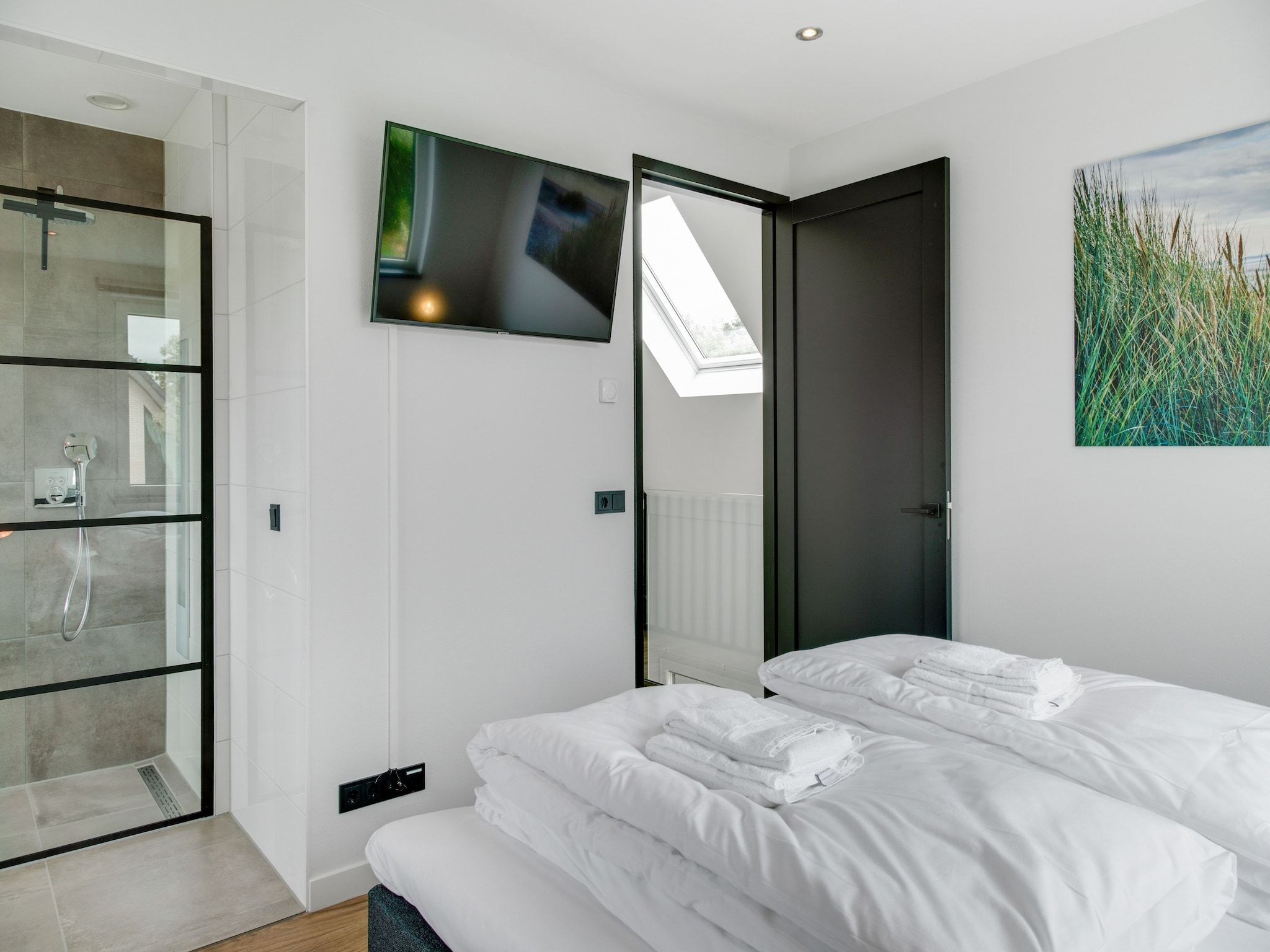 Een slaapkamer van De Koog  nr 5 - 6 pers woning de luxe in De Koog Texel