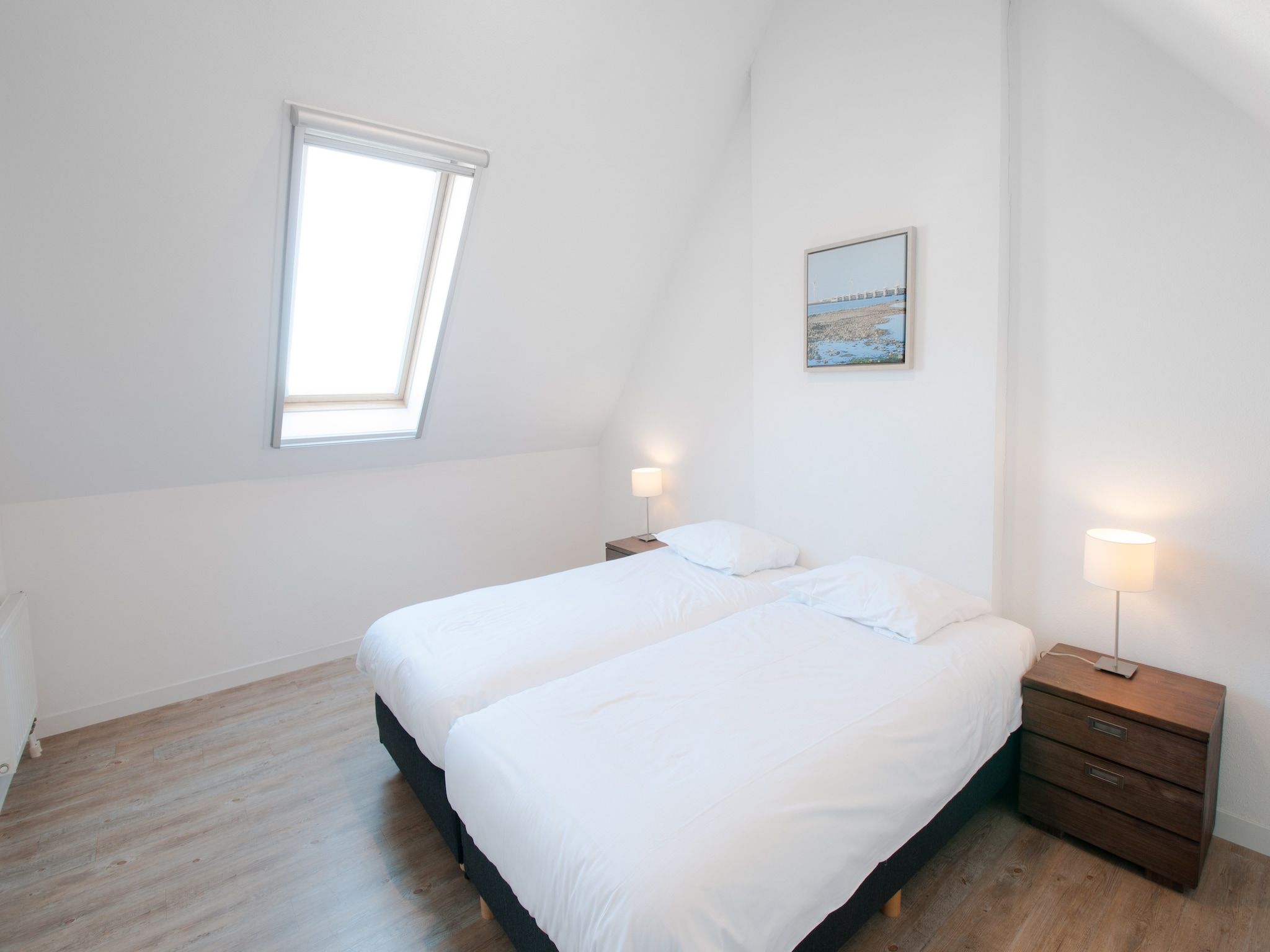 Een slaapkamer van Resort Waterrijk Oesterdam 5 in Tholen