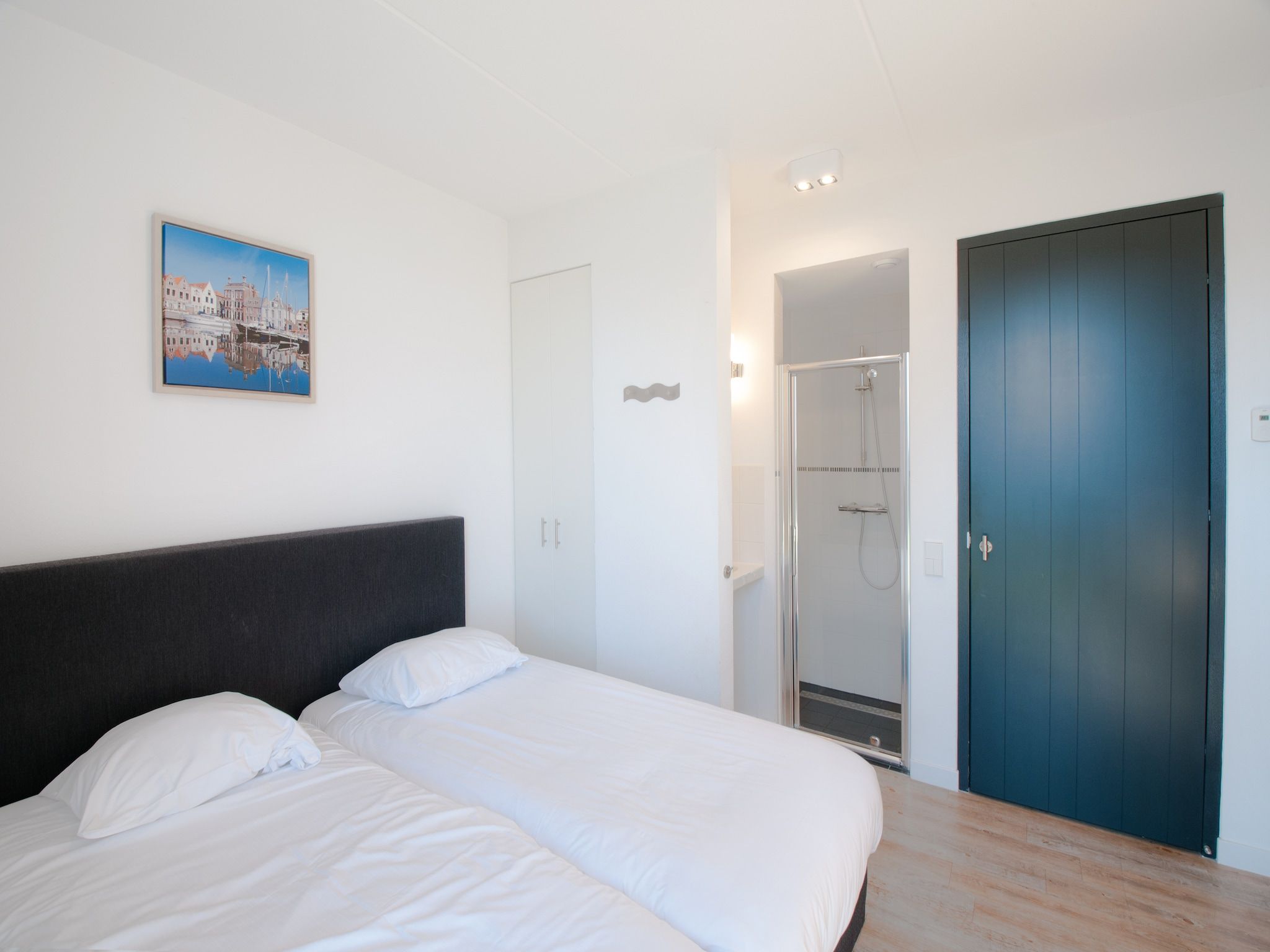 Een slaapkamer van Resort Waterrijk Oesterdam 5 in Tholen