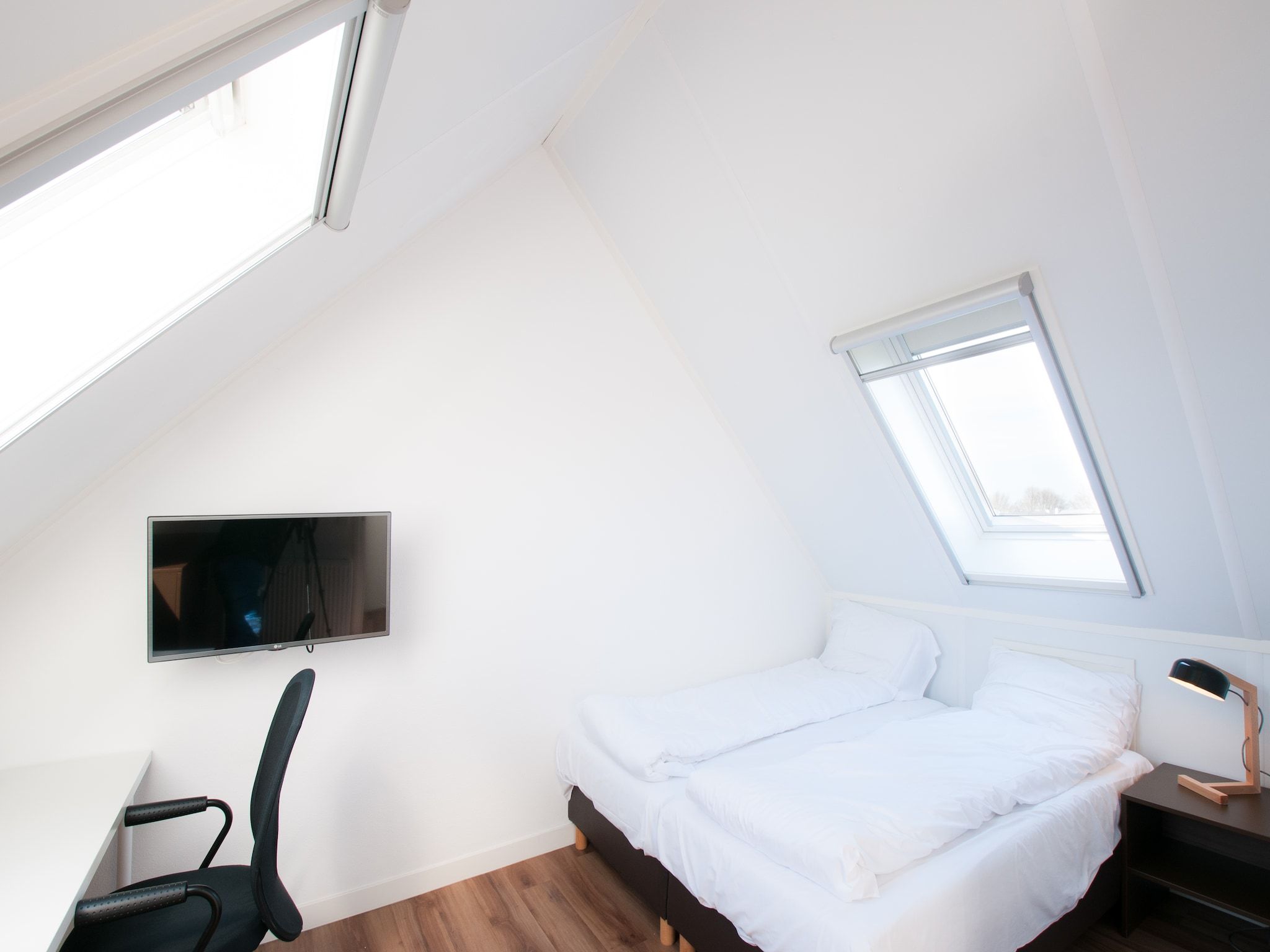 Een slaapkamer van Resort Waterrijk Oesterdam 6 in Tholen