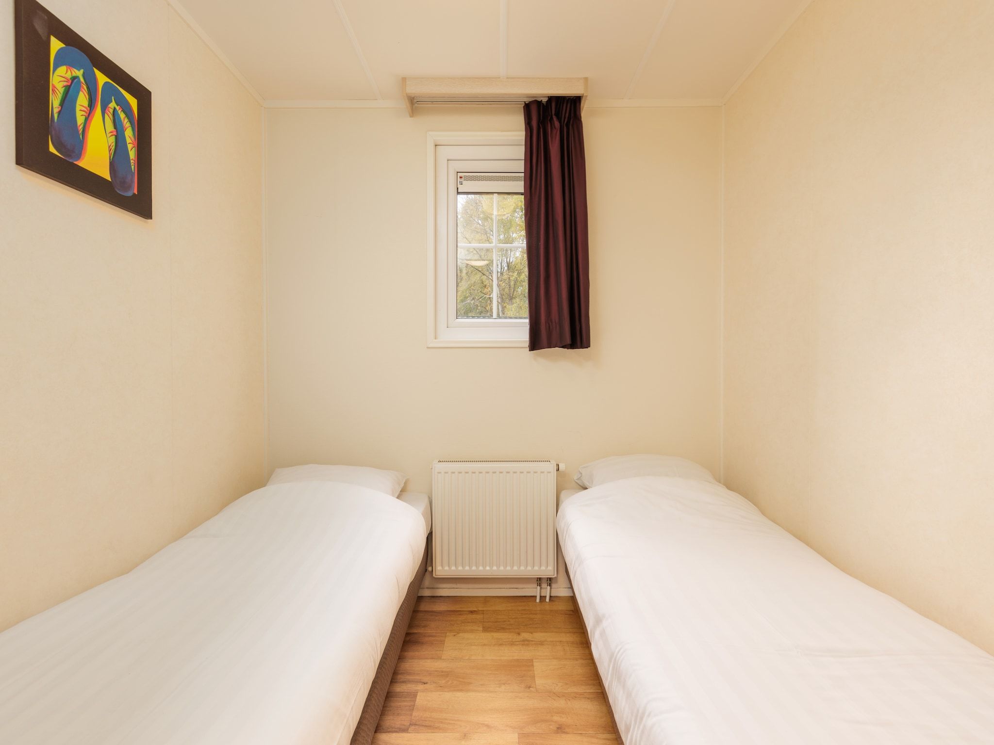 Een slaapkamer van Vakantiepark Hunzedal 13 in Borger