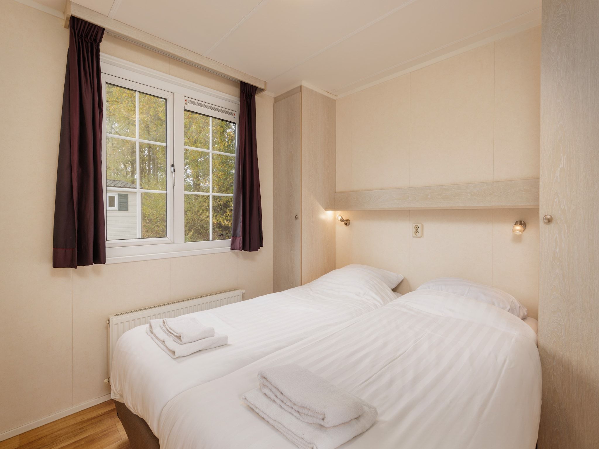 Een slaapkamer van Vakantiepark Hunzedal 13 in Borger