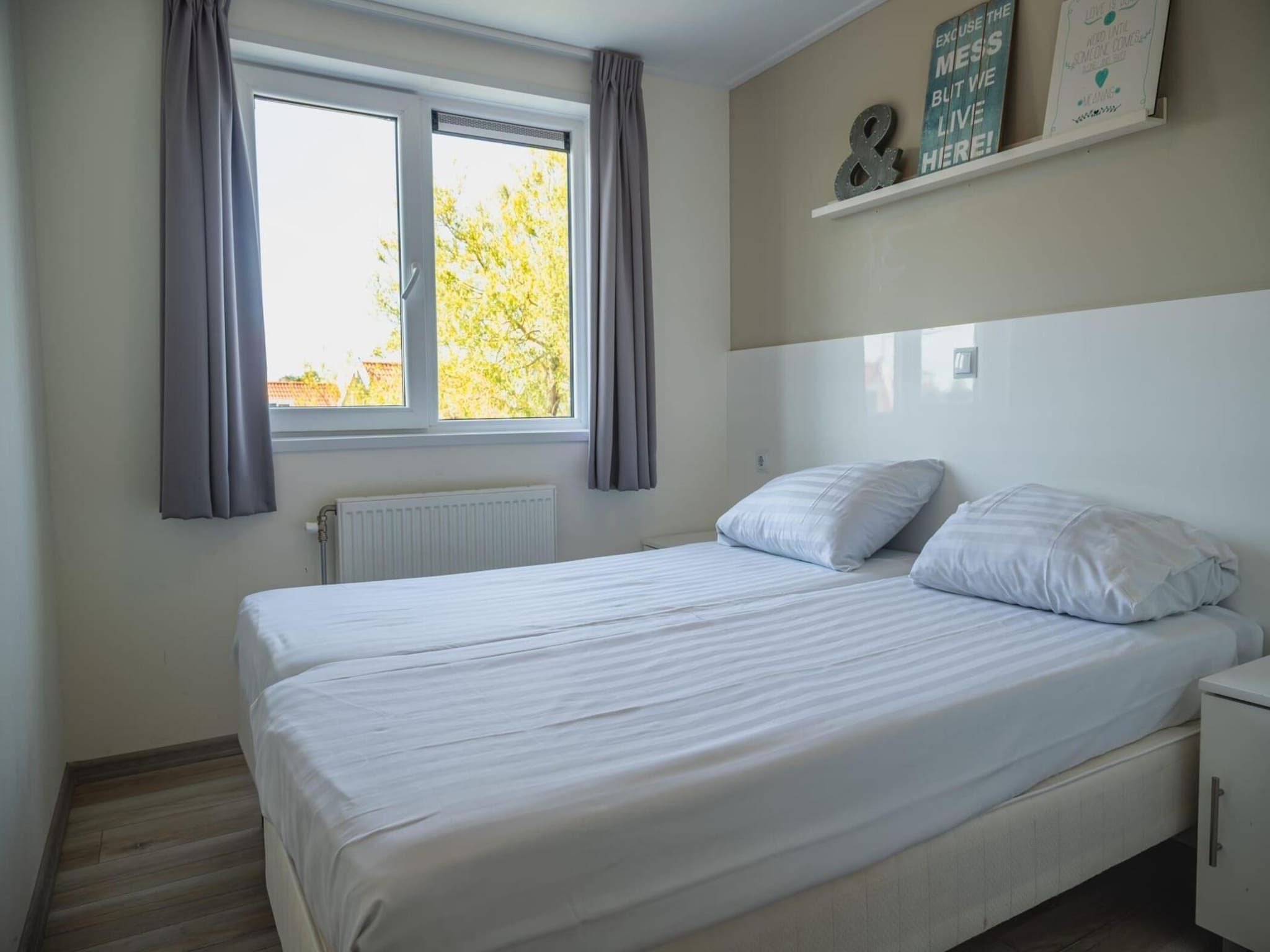 Een slaapkamer van Beemsterdijk met Sauna  10 personen in West-Graftdijk