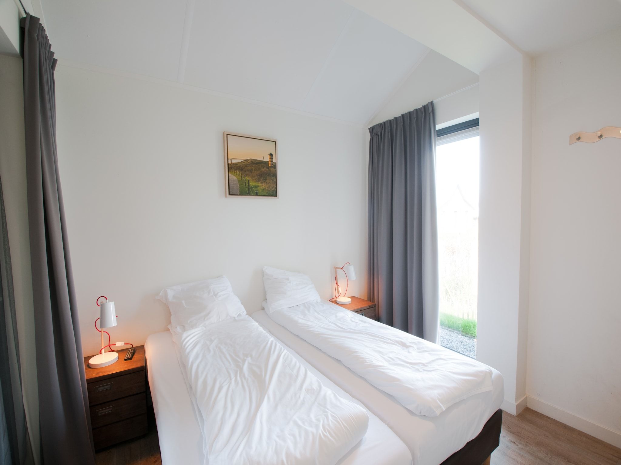 Een slaapkamer van Resort Waterrijk Oesterdam 8 in Tholen