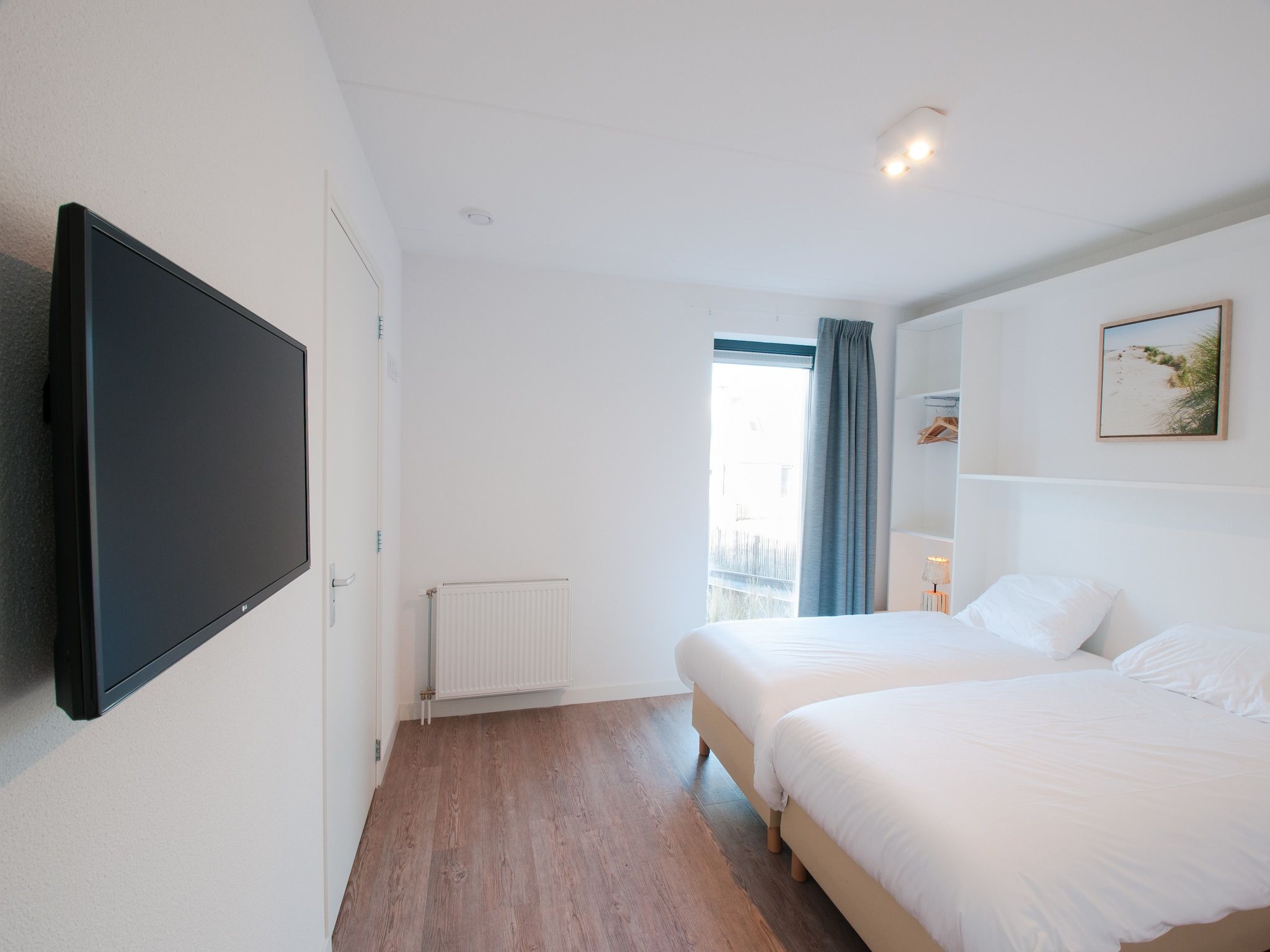 Een slaapkamer van Resort Waterrijk Oesterdam 14 in Tholen